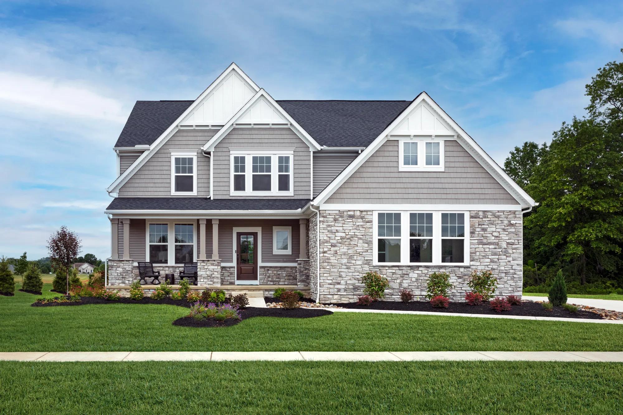 custom home with shakes and stone exterior