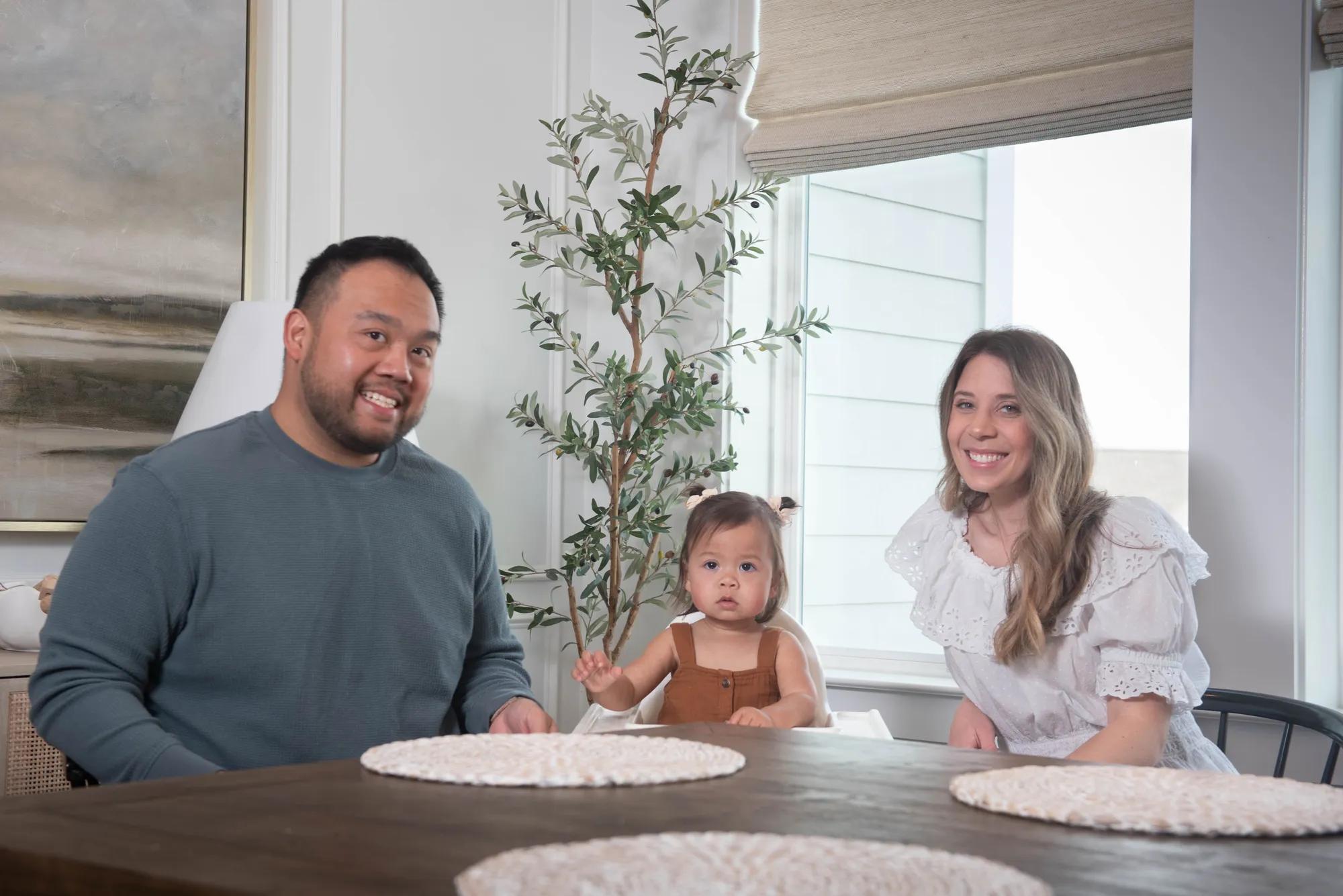 New homeowners in their beautiful bright kitchen