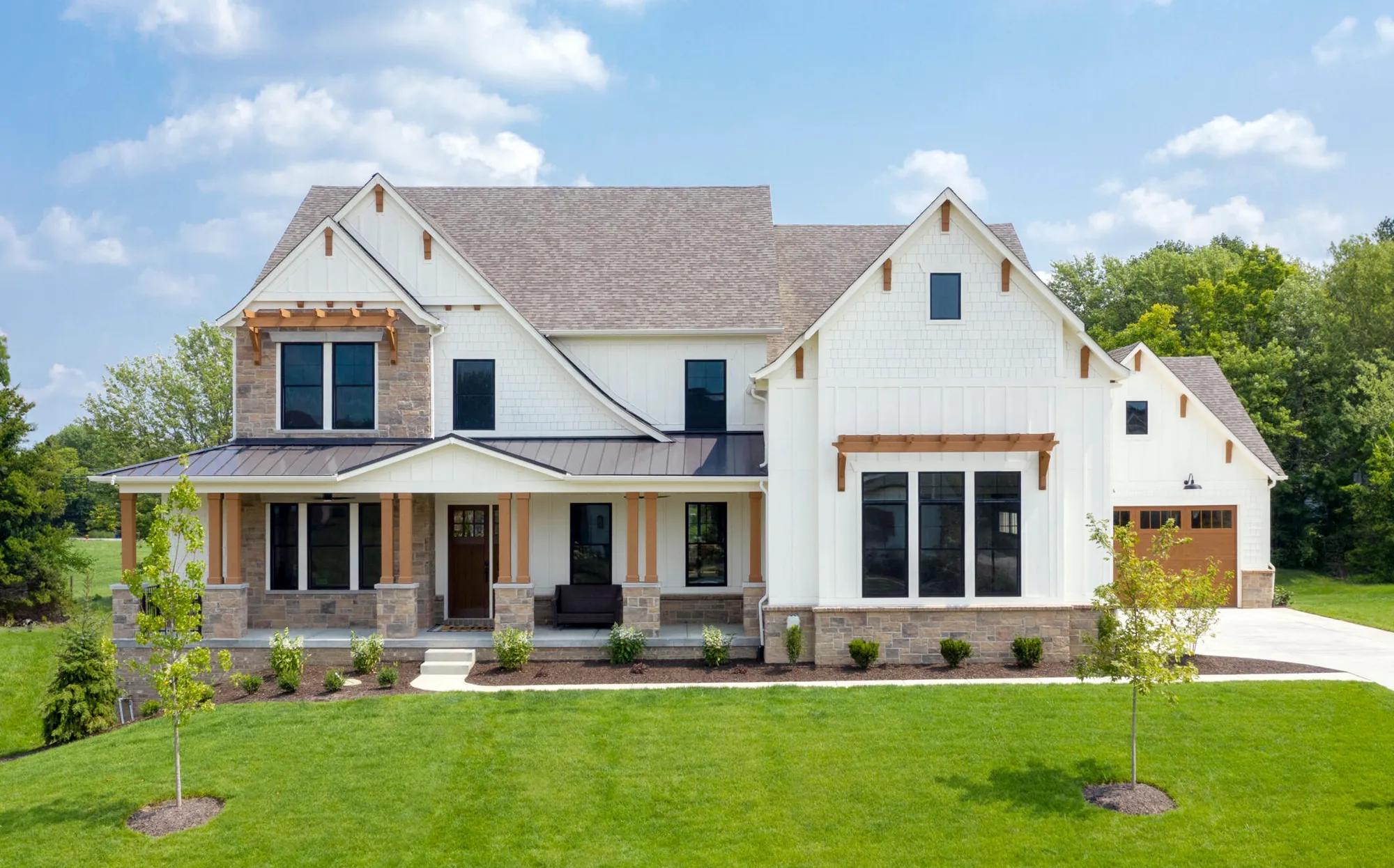 This gorgeous home exterior has stone and wooden accents
