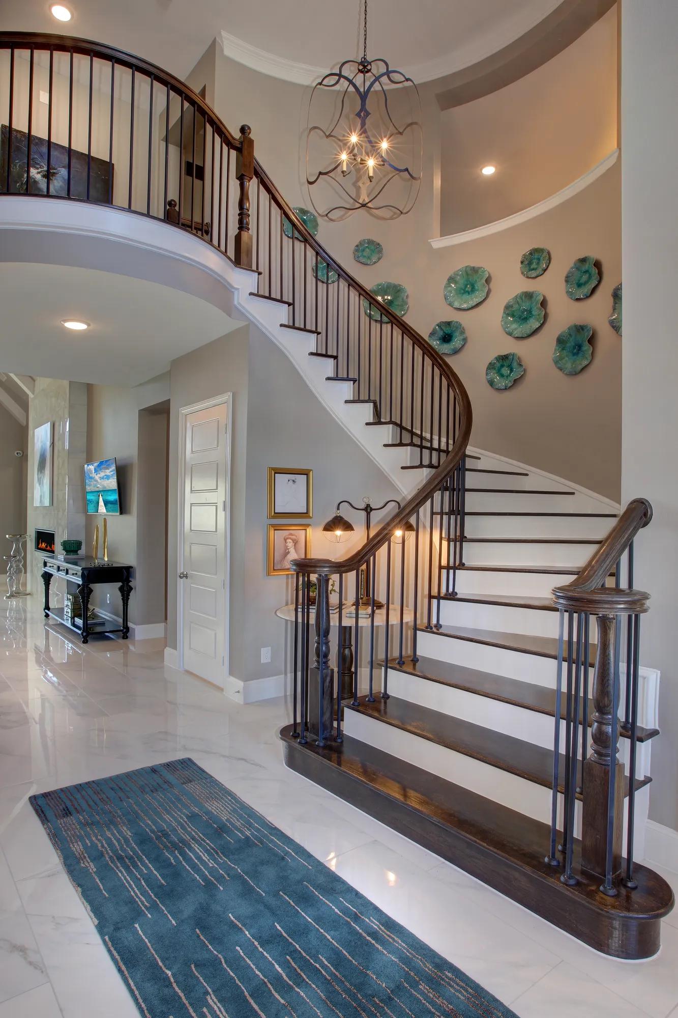 Two-story foyer with spiral staircase