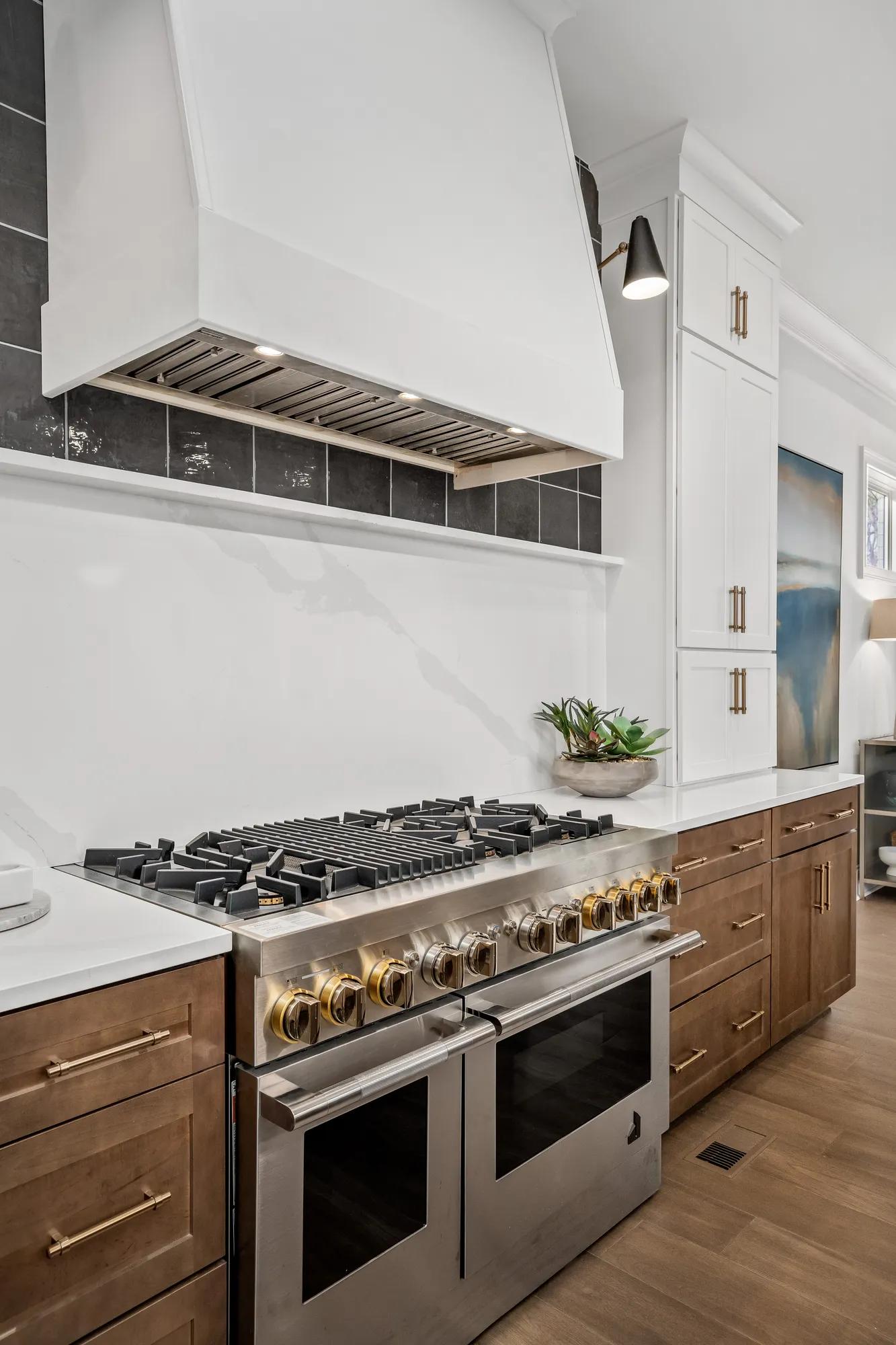 custom kitchen with stainless steel gas range