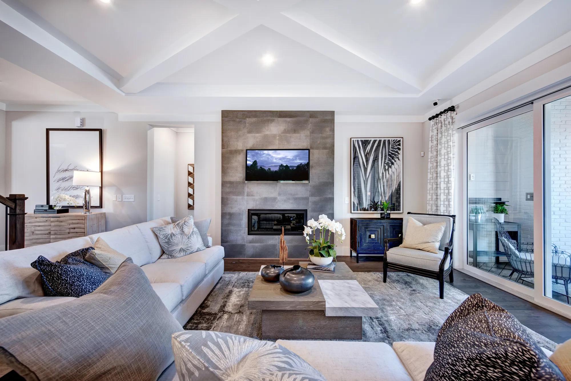 family room with contemporary fireplace with tile surround