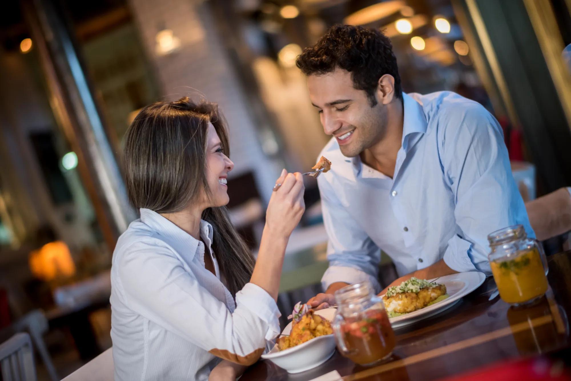 couple sharing dinner at a restaurant