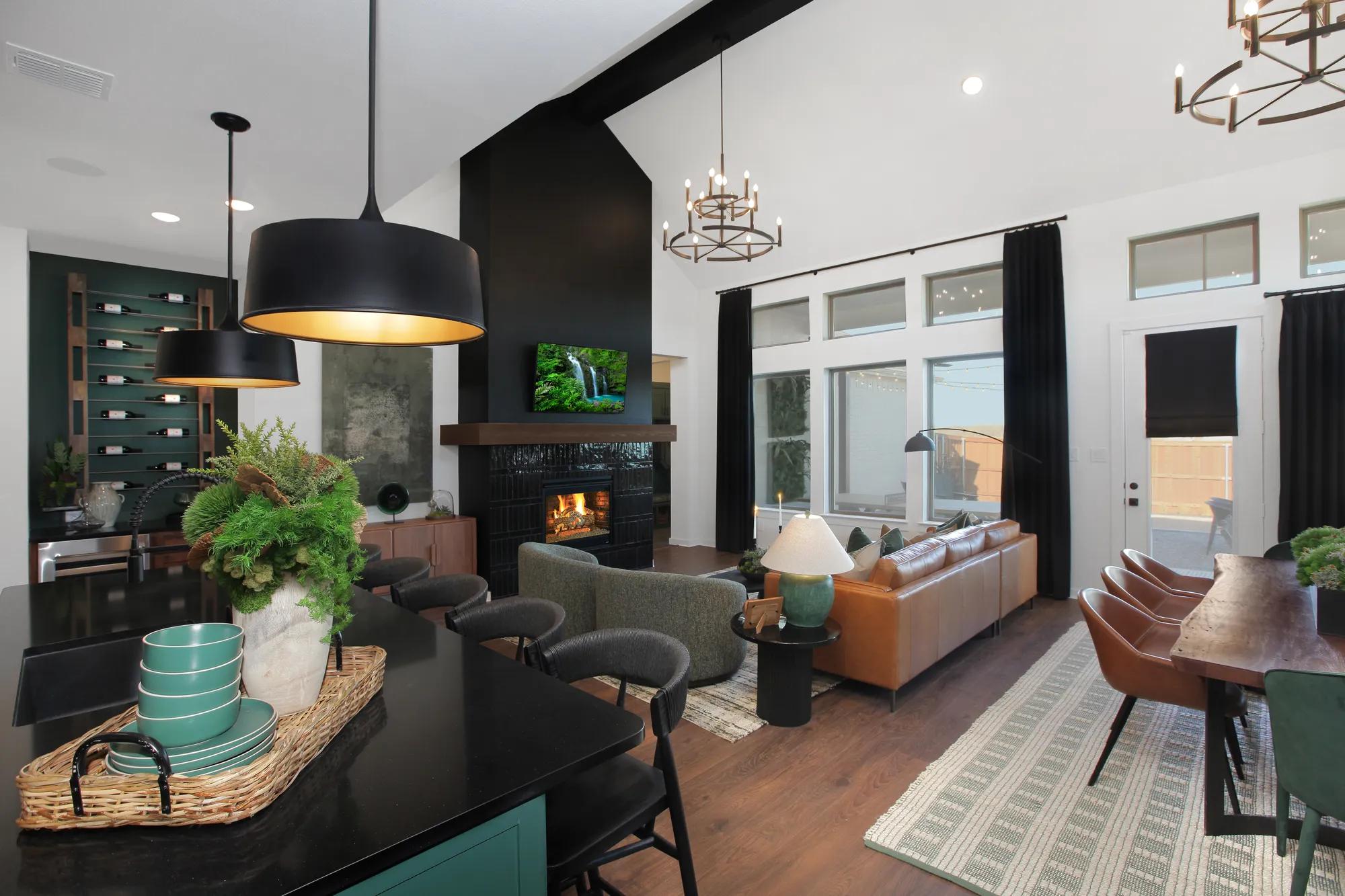 open concept great room and kitchen with vaulted ceiling