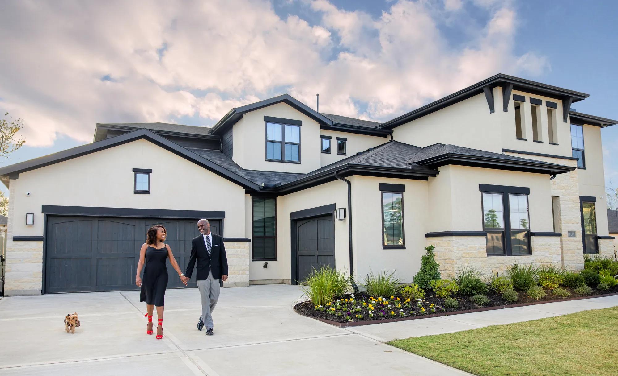 New homeowners enjoying their beautiful brick Drees Home
