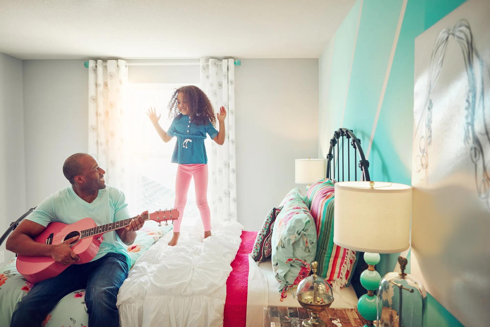 Father and daughter playing in home