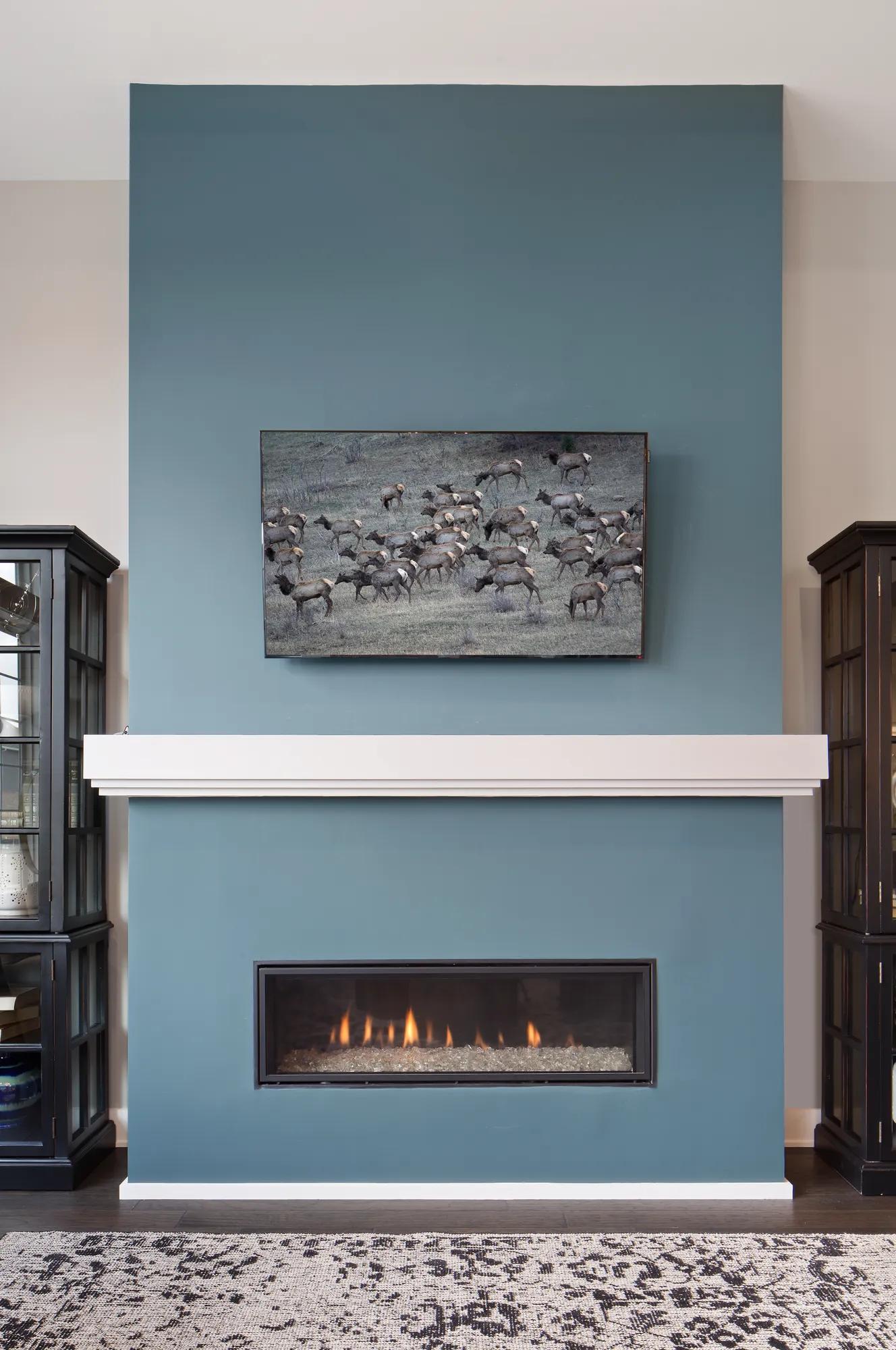 Contemporary fireplace with wood mantle