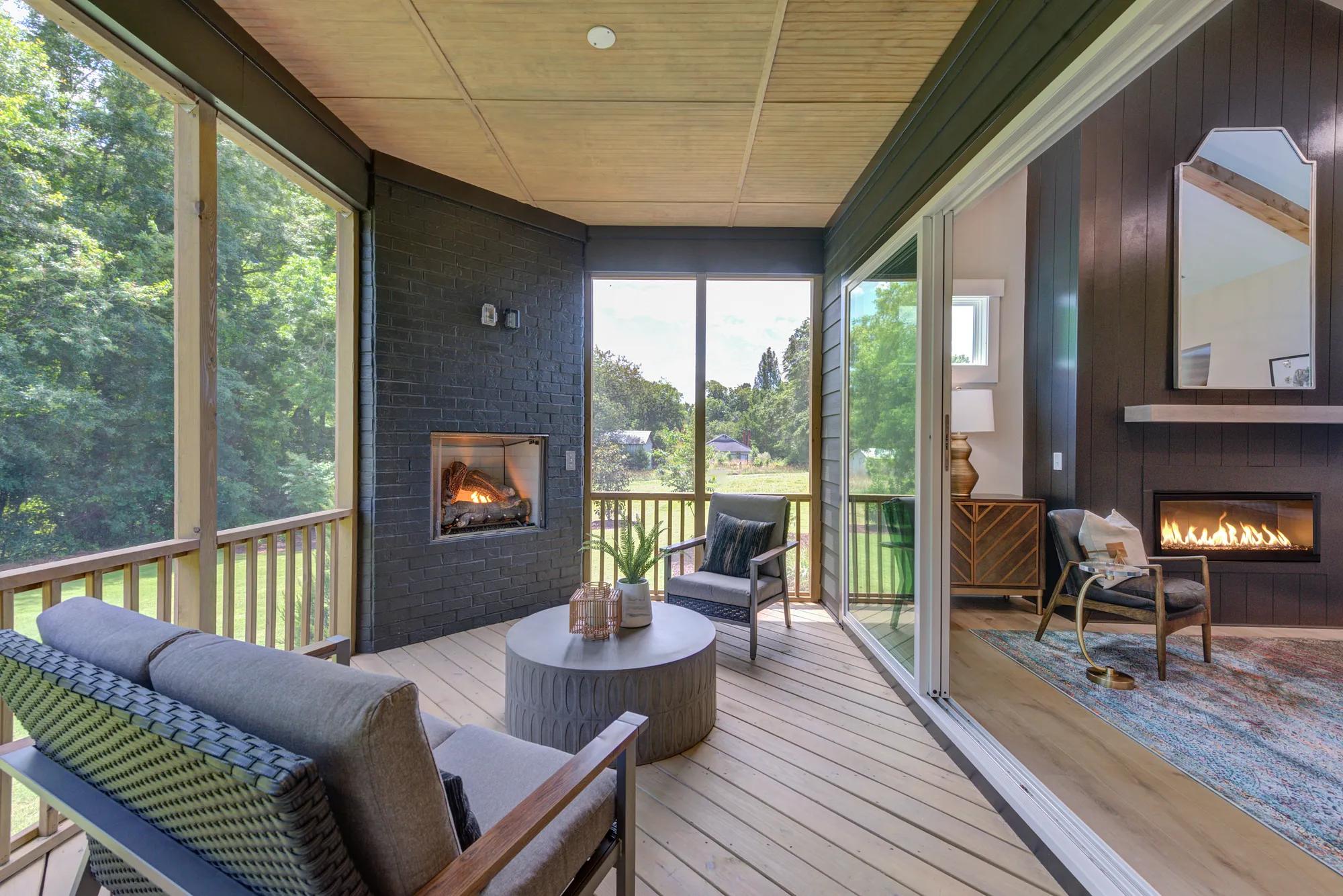 custom outdoor living area with sliding glass door and fireplace