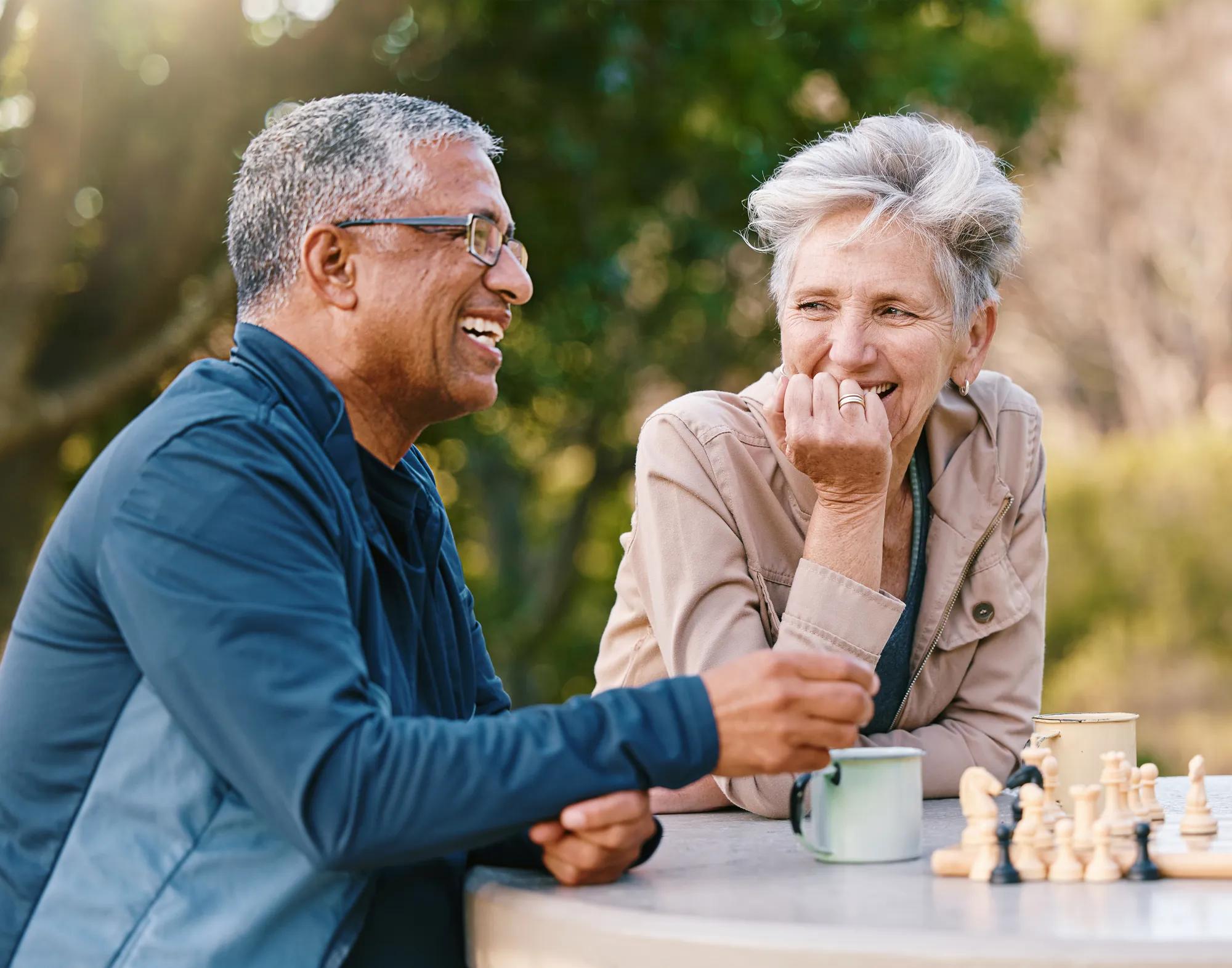 Couple enjoying coffee and games outside