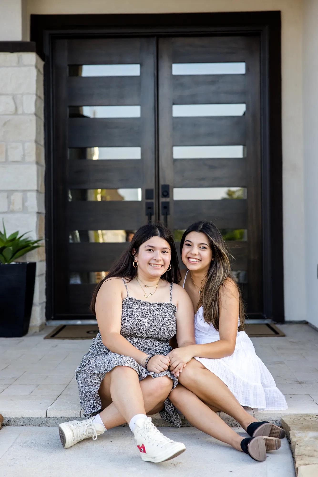 New homeowners enjoying their gorgeous front porch of their Lauren style home