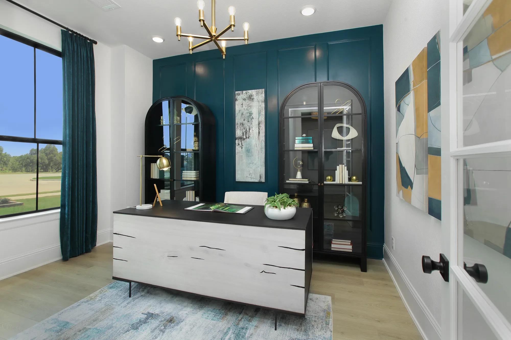 New home office with blue wainscoting accent wall and light hardwood floors
