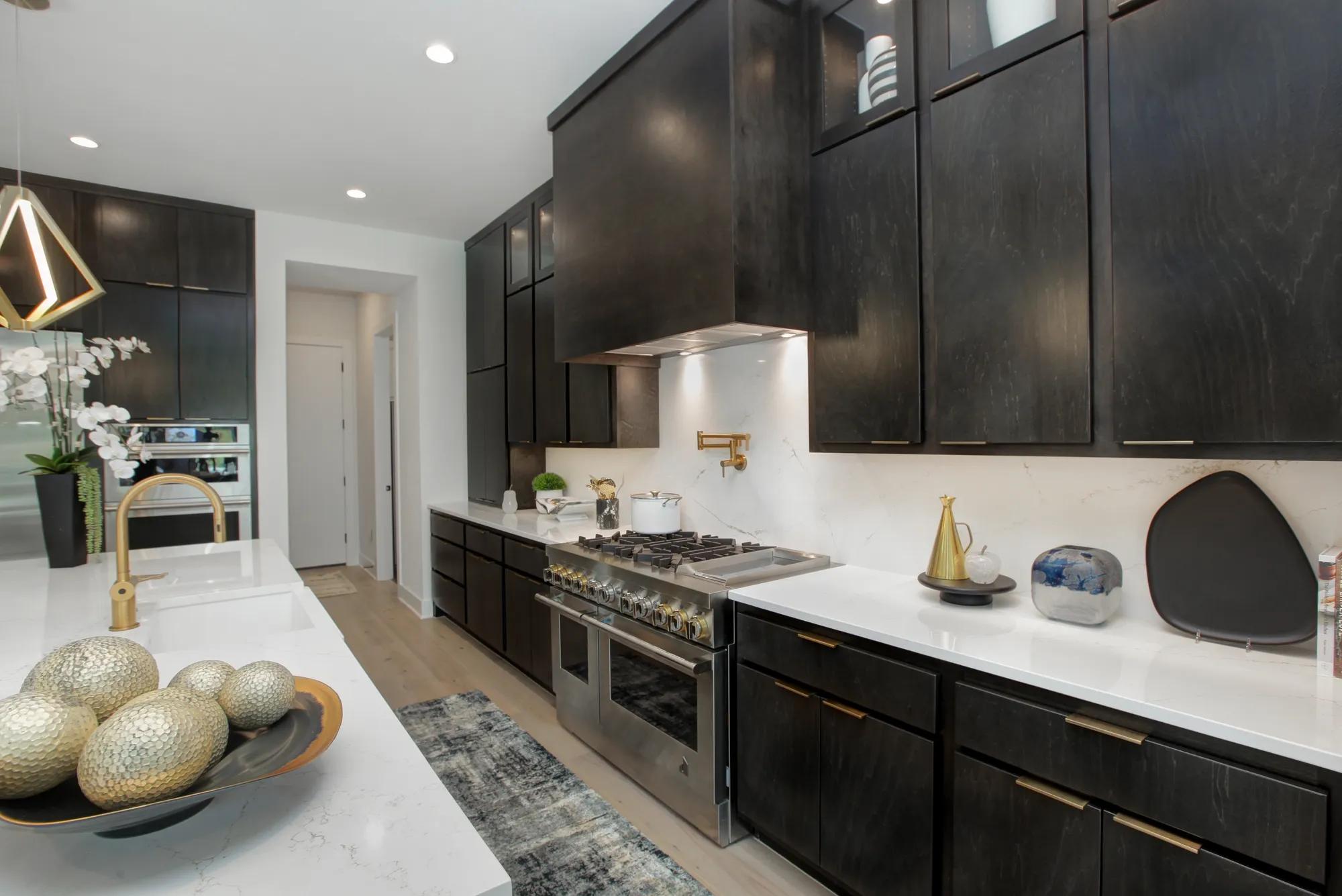 new Drees home modern kitchen with gold hardware