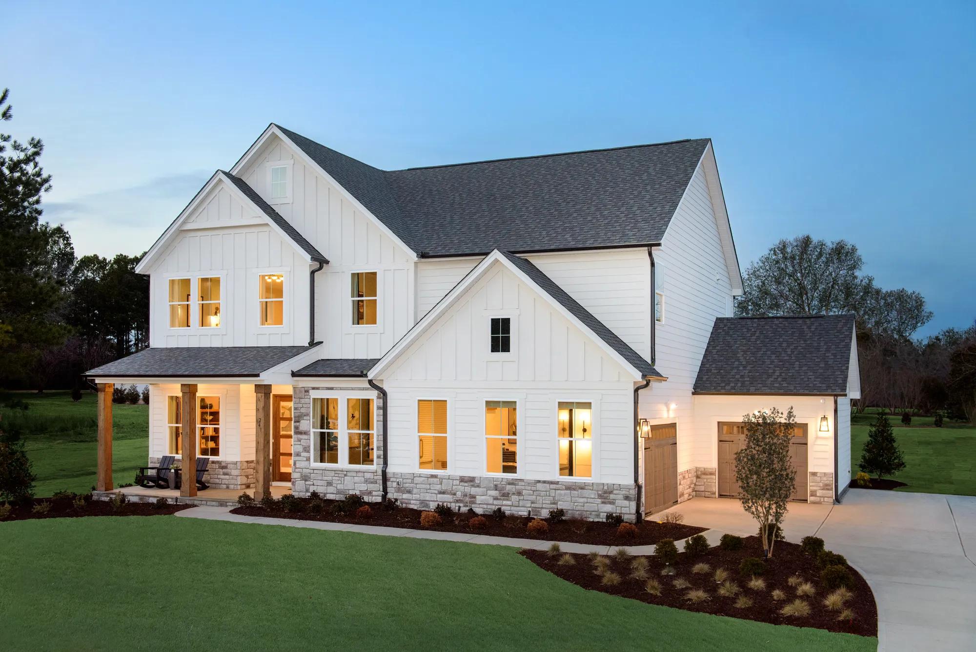 White siding two story custom home with stone and cedar accents