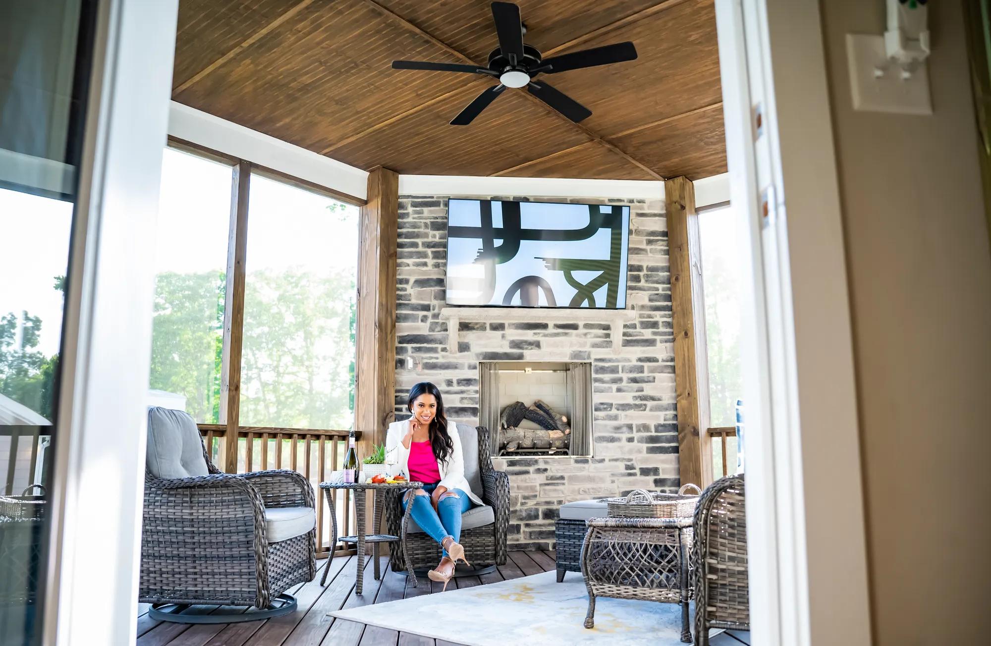 beautiful covered porch with stone fireplace