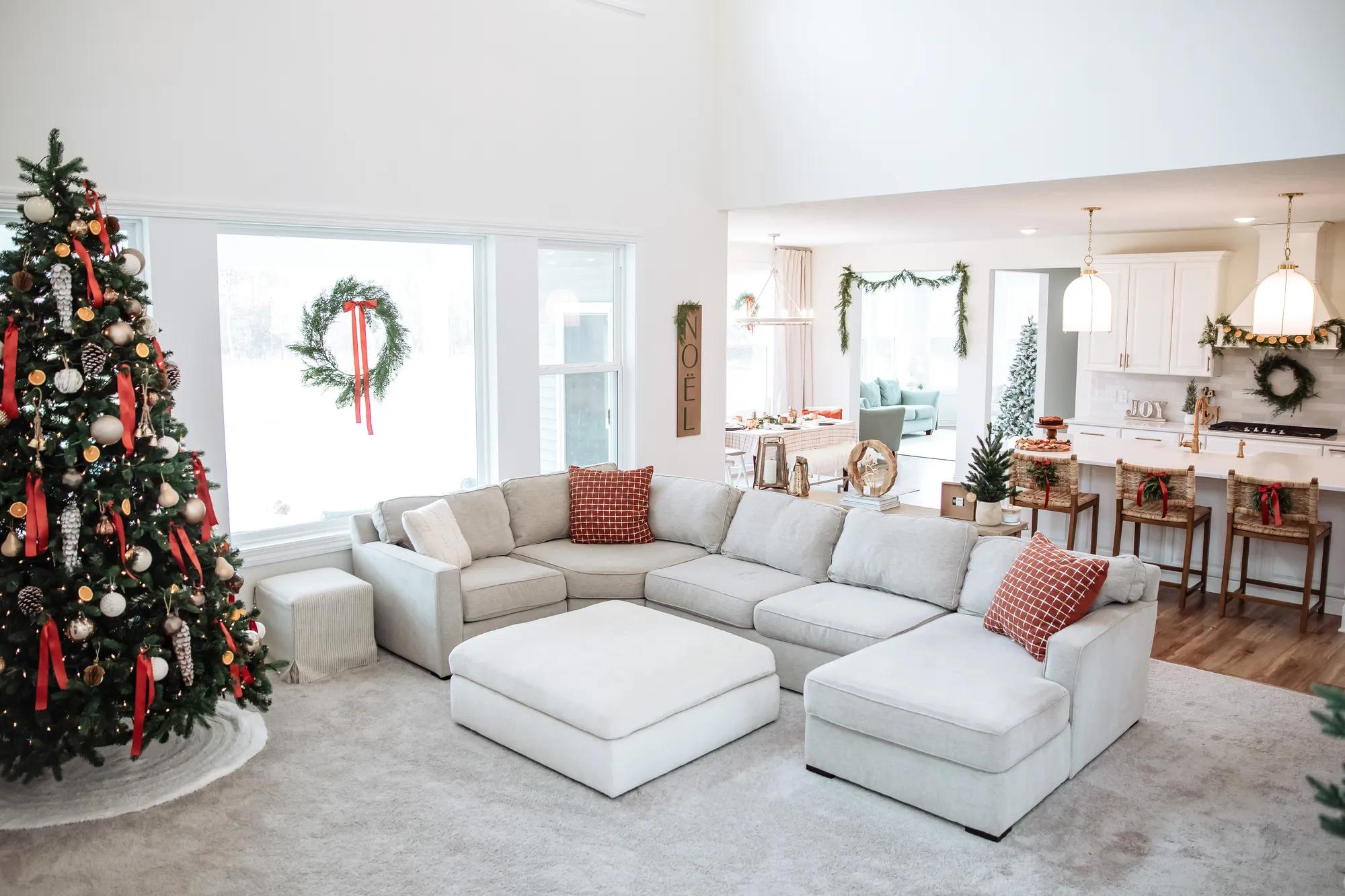 A gorgeous red, silver, and gold Christmas tree in the family room of a new home