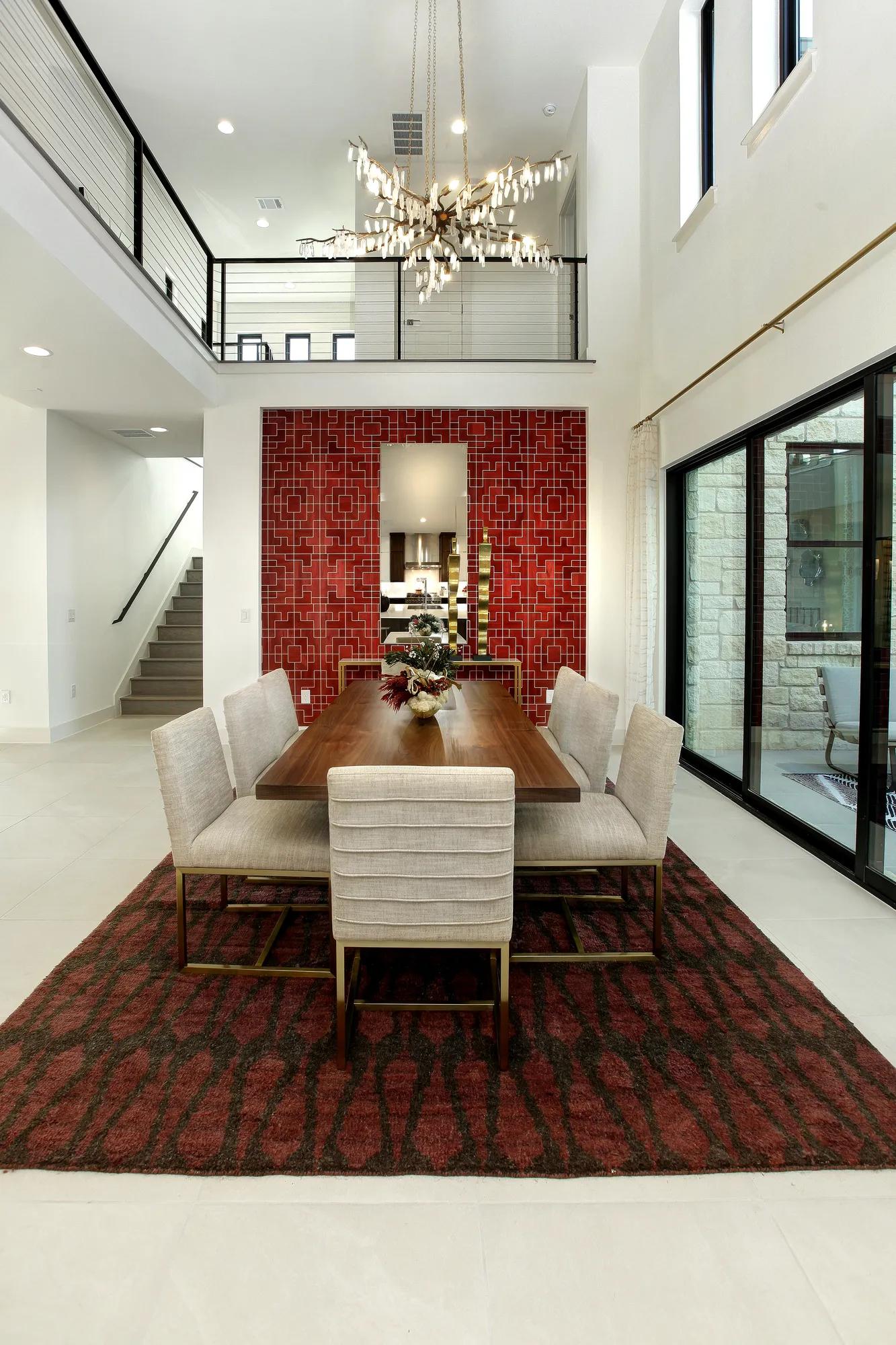 two-story dining room with chandelier