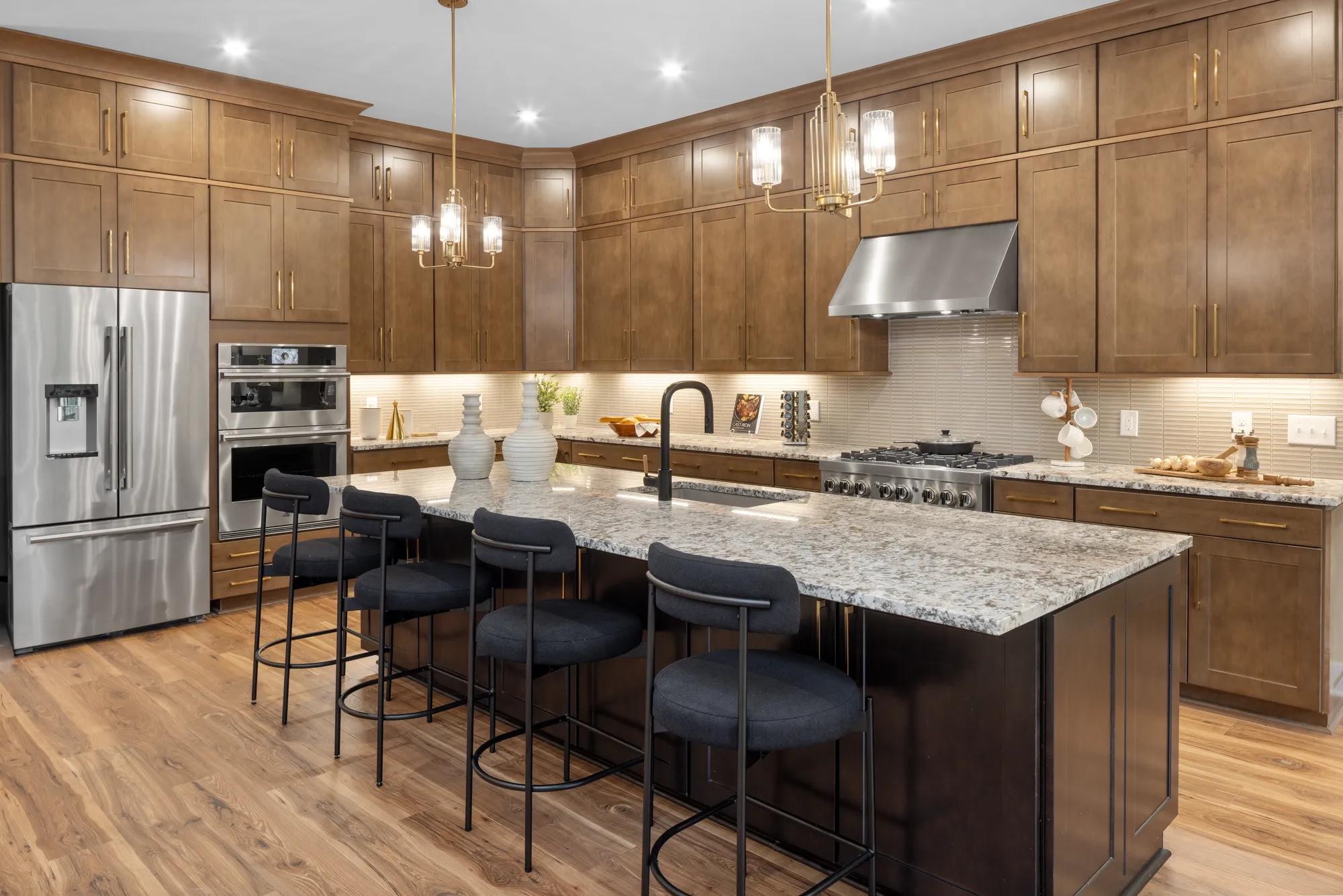 Custom home luxury kitchen with wood cabinets and stainless steel appliances 