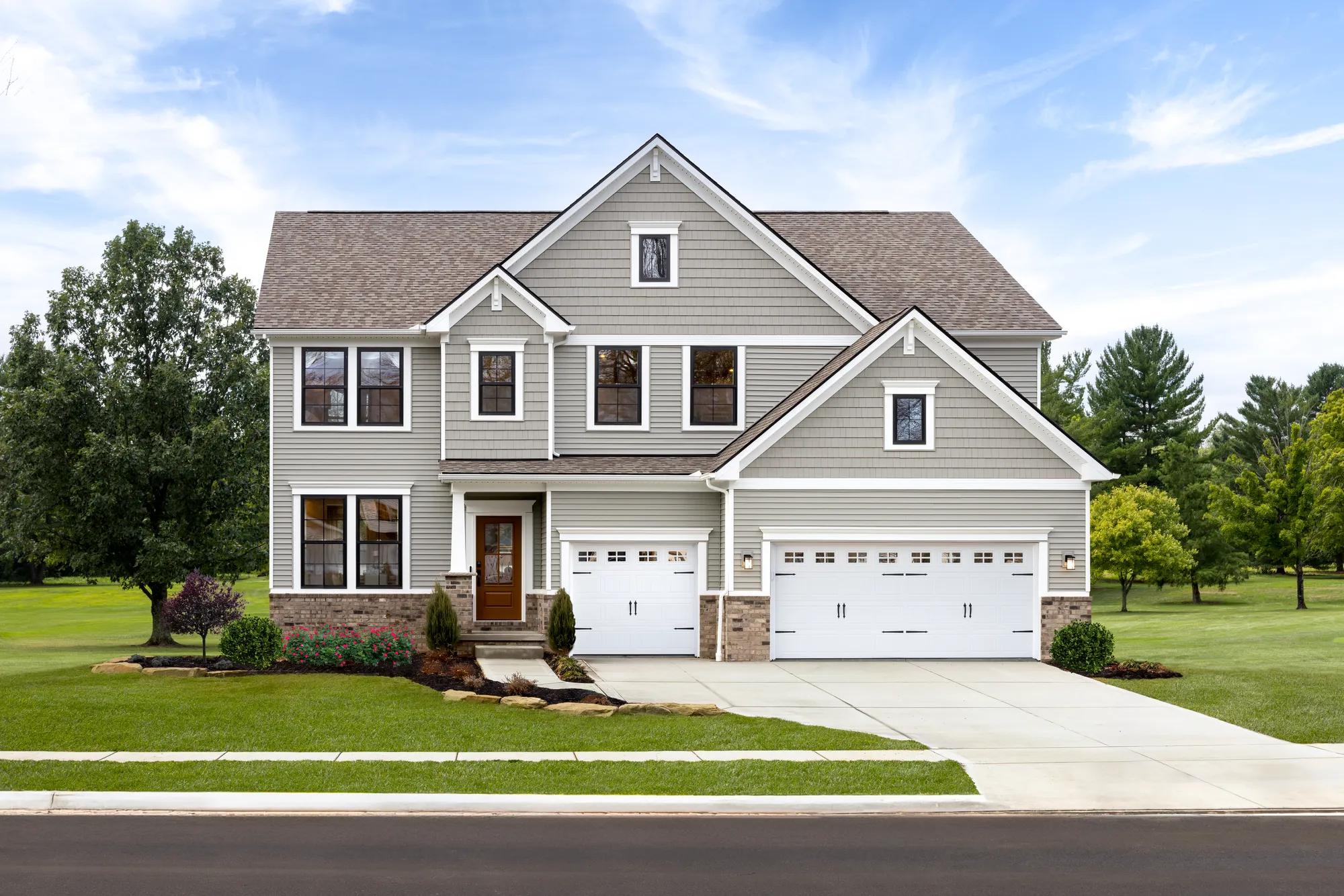 New home front exterior with three car garage