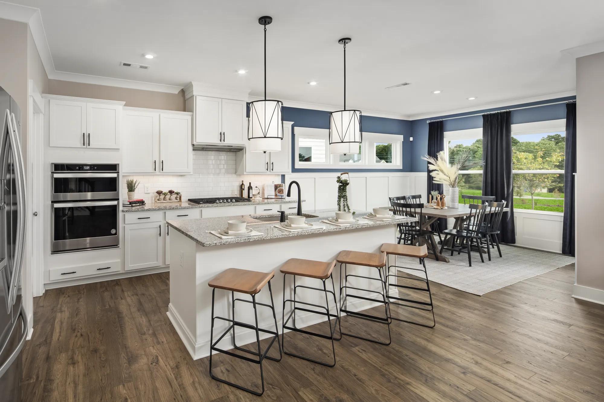kitchen with large island and white cabinets