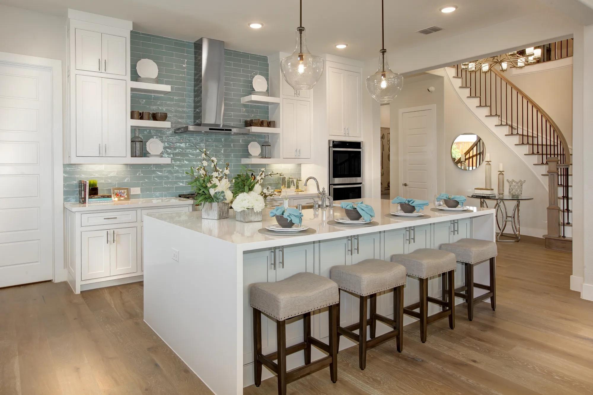 Kitchen with waterfall quartz on island