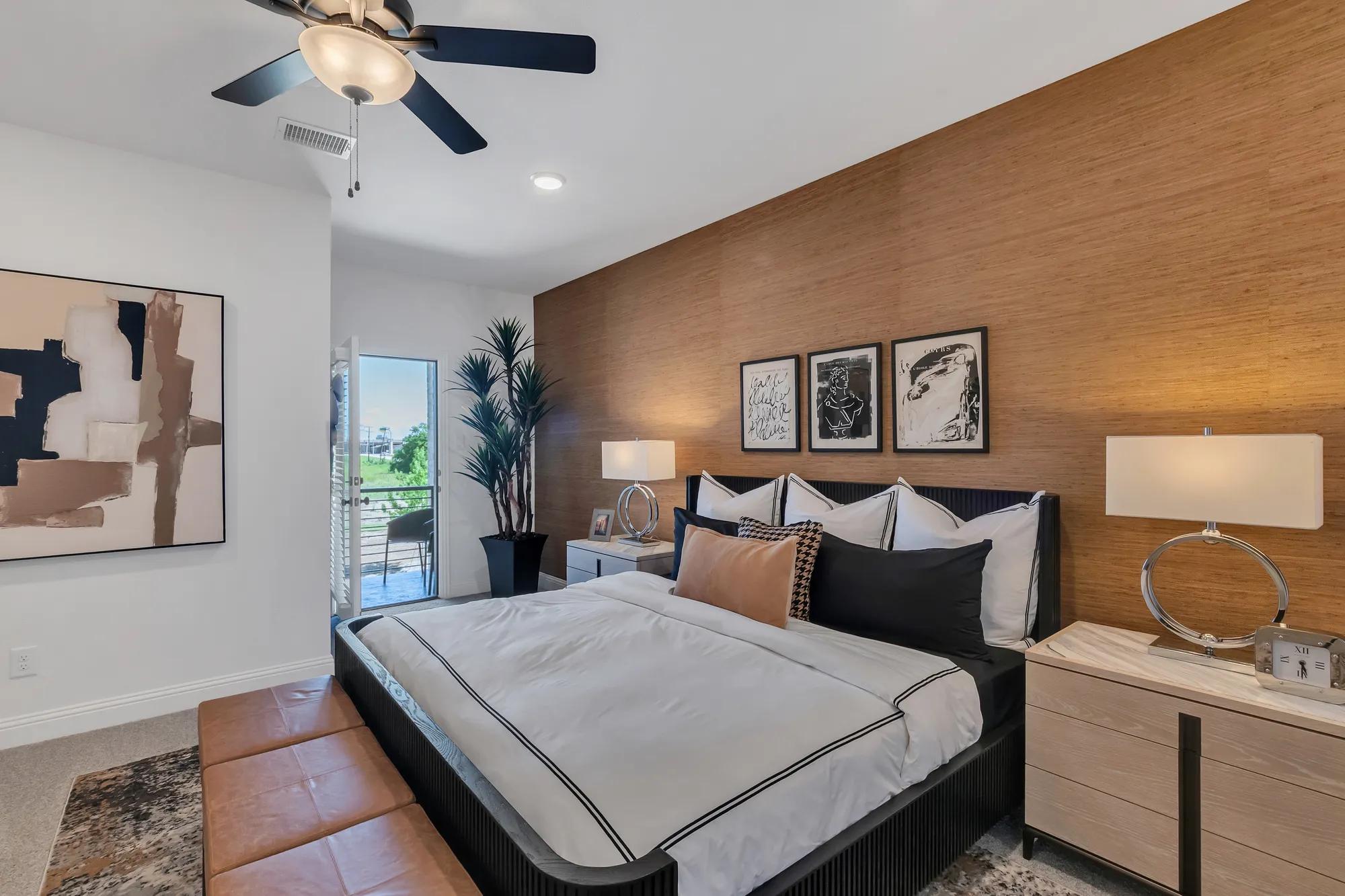 New townhome primary suite bedroom with porch walk out