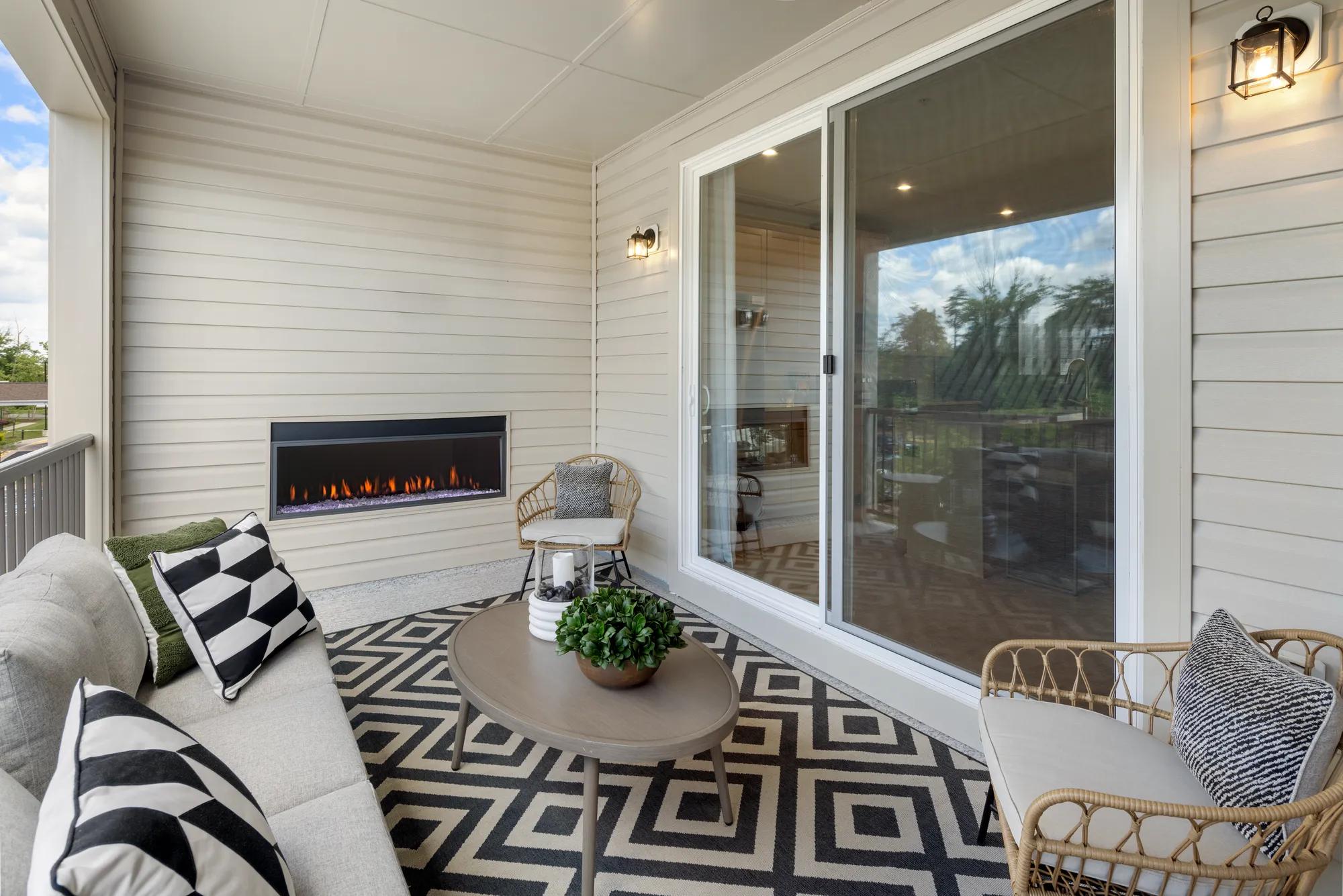 new townhome outdoor living area with fireplace