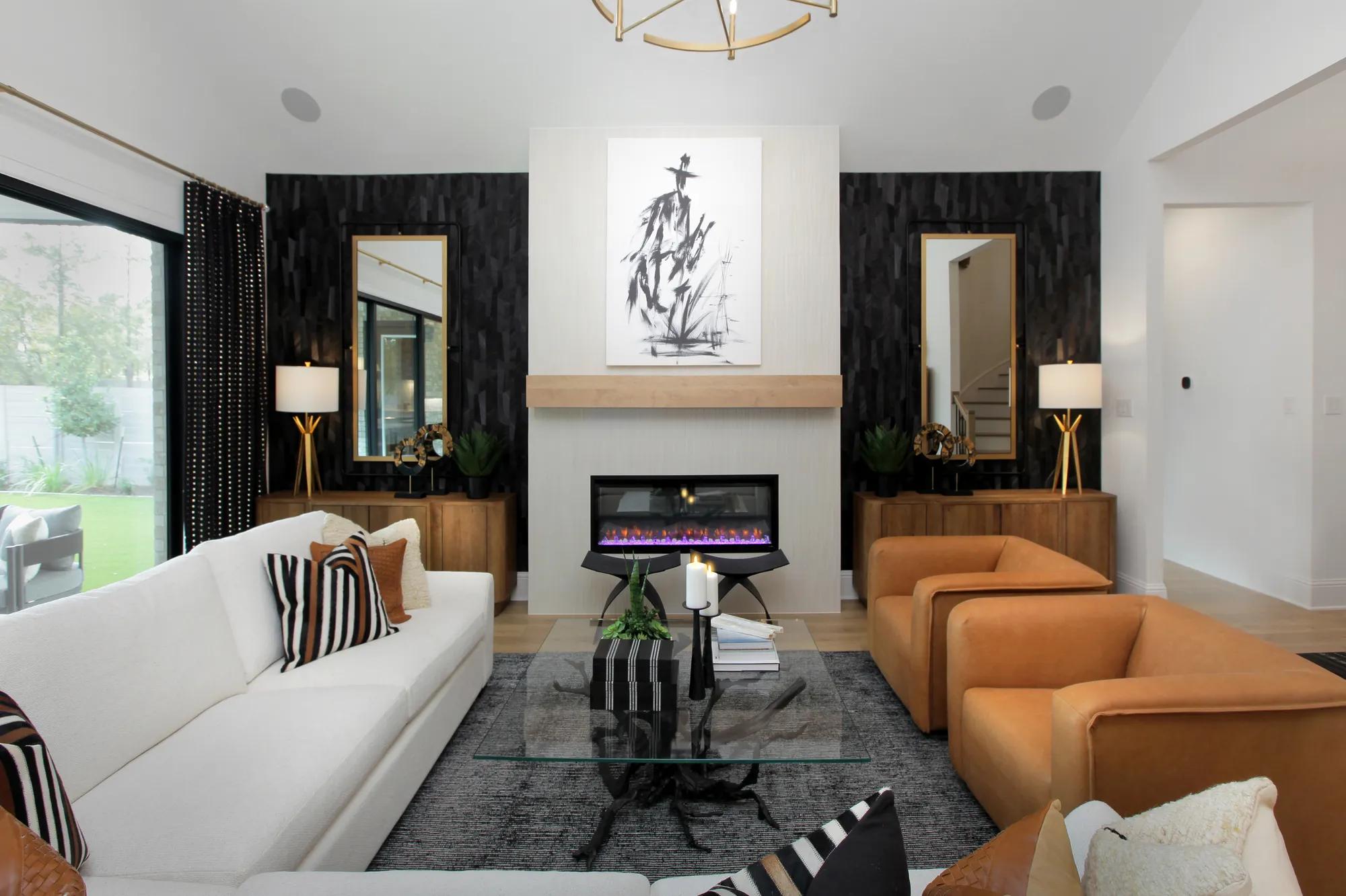 Custom home family room with off-white tile fireplace and black wallpaper