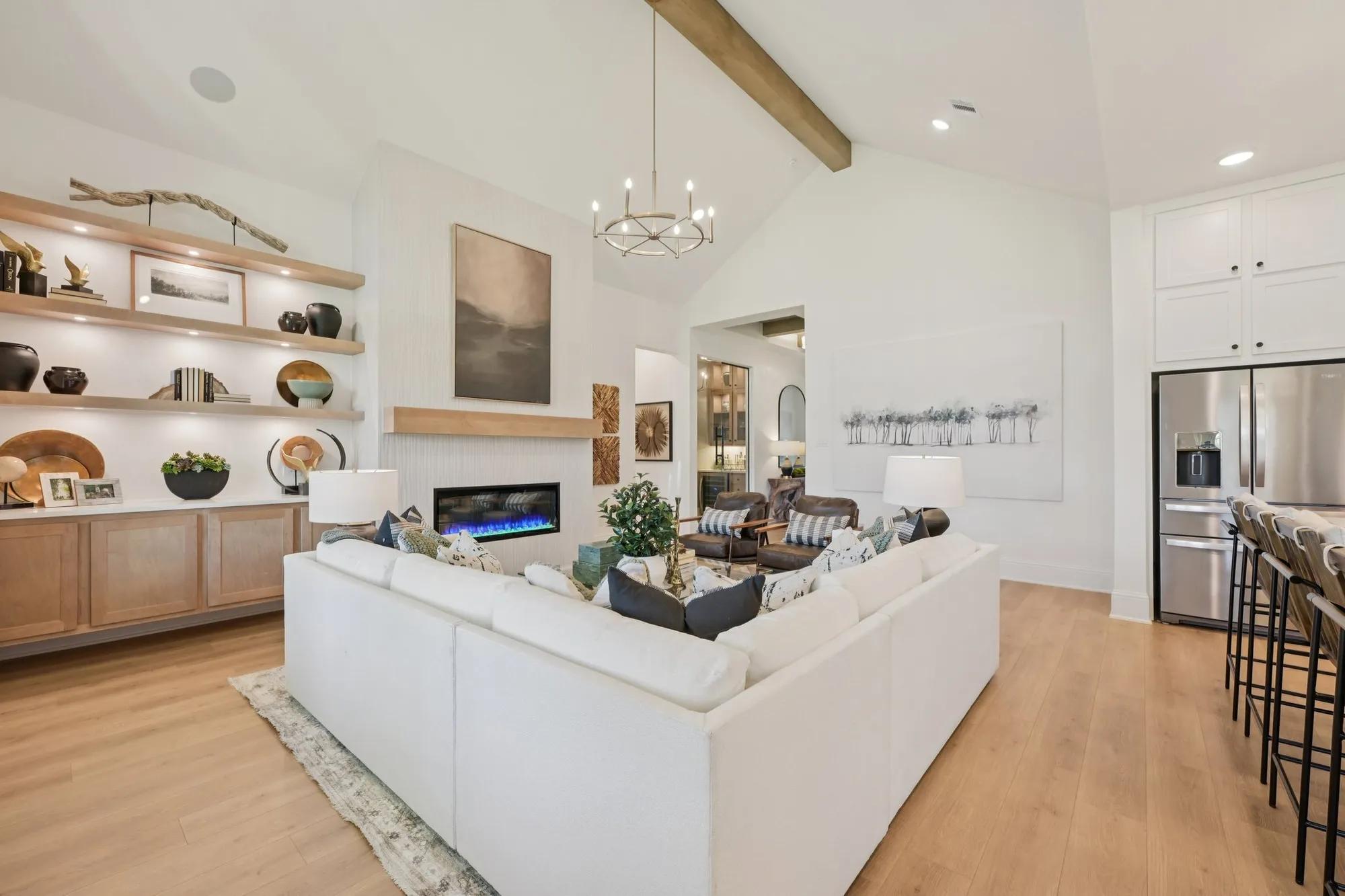 Custom home family room with fireplace and light wood built-ins