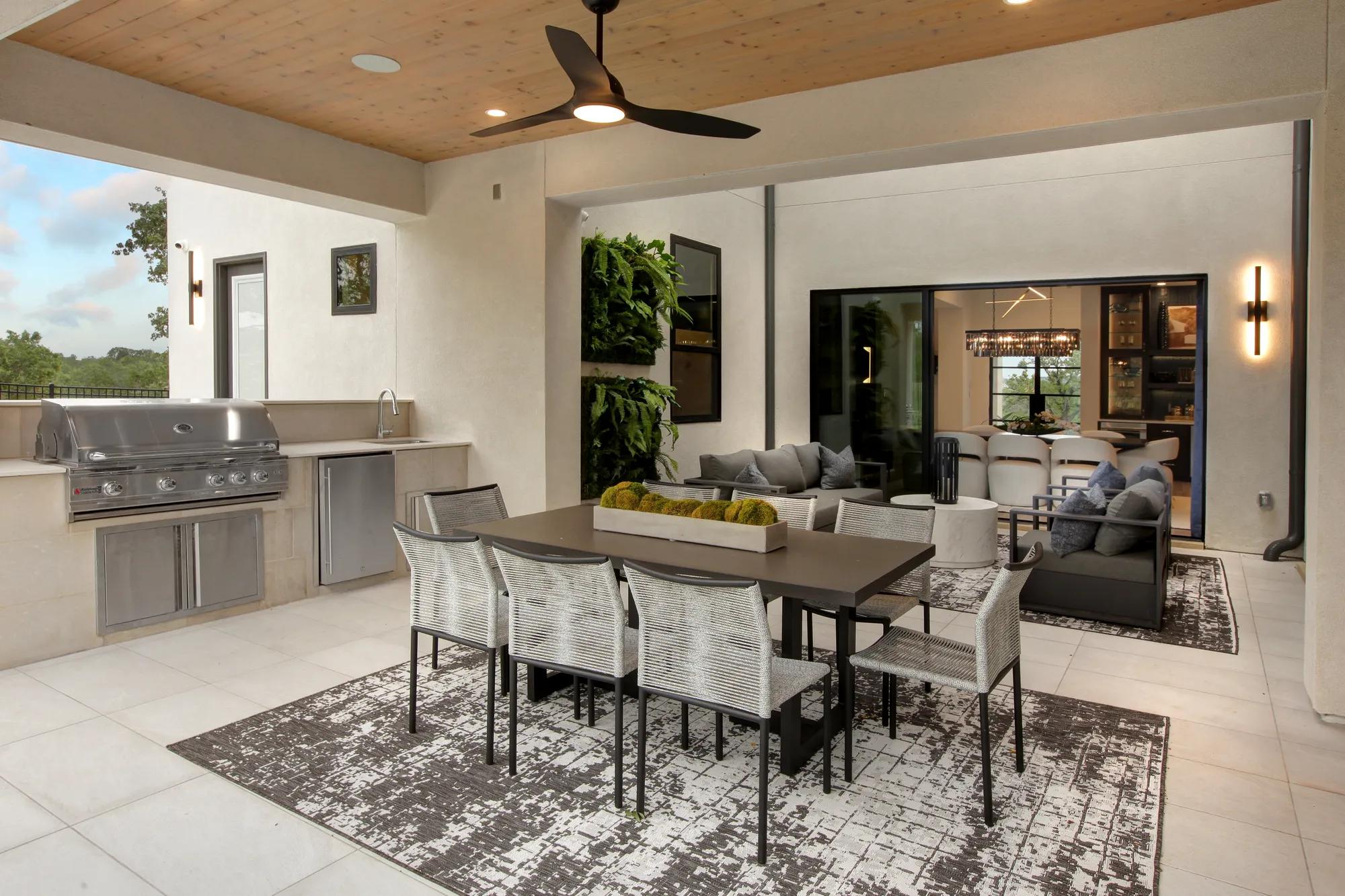 new Drees home outdoor living area with grill and countertops