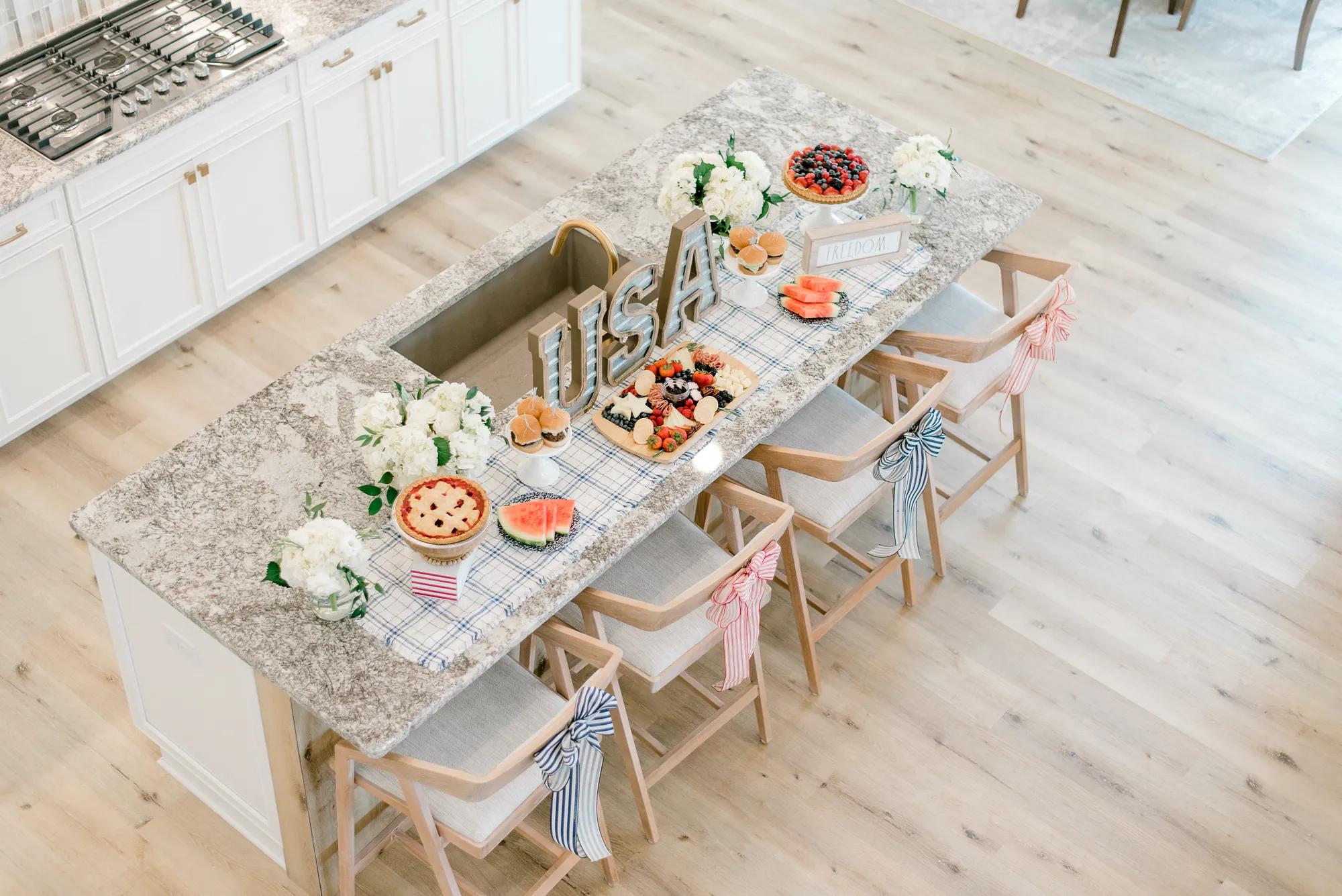 A gorgeous custom kitchen with beautiful patriotic decorations for the 4th of July