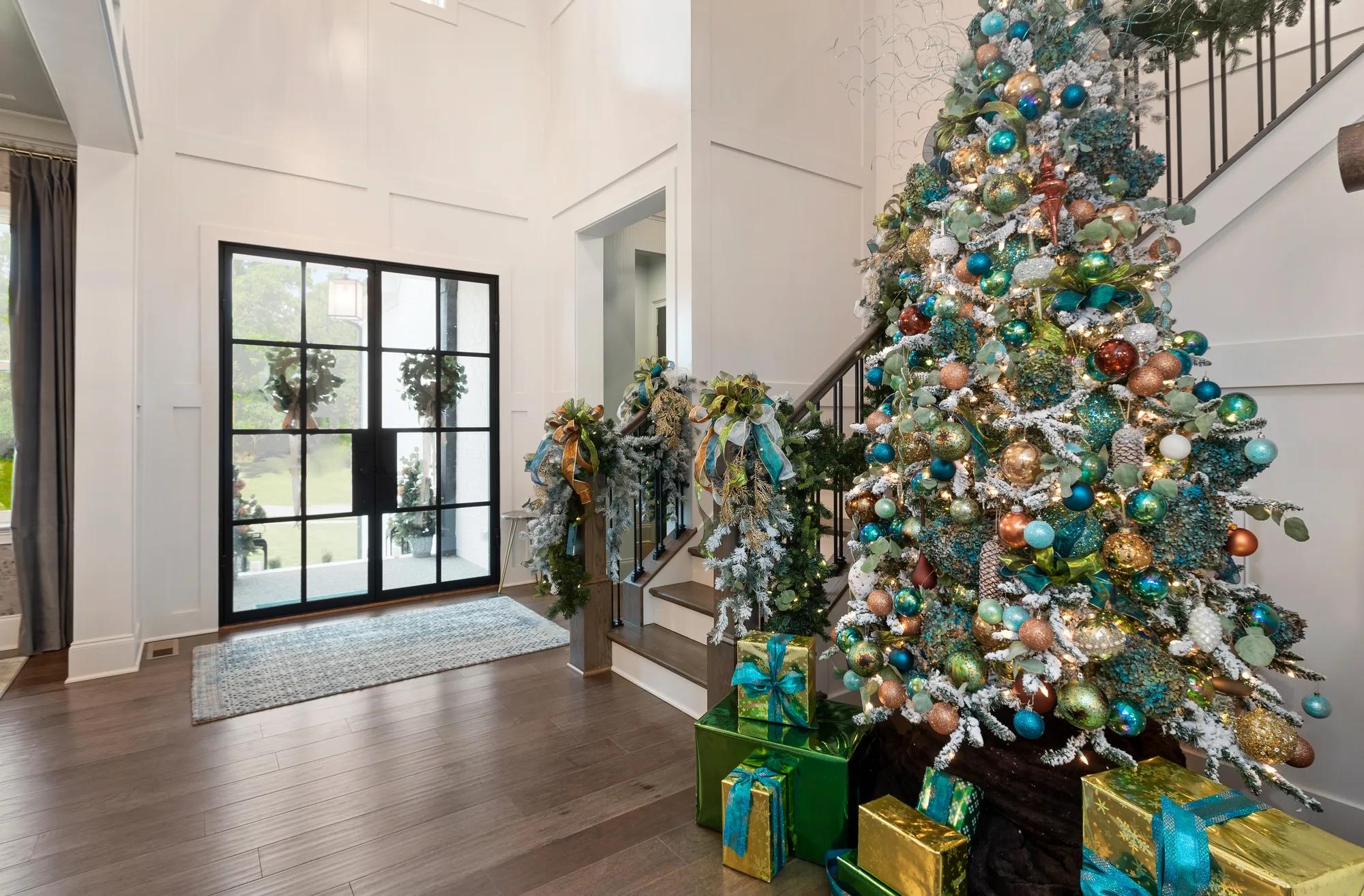 entryway with staircase decorated for the holidays