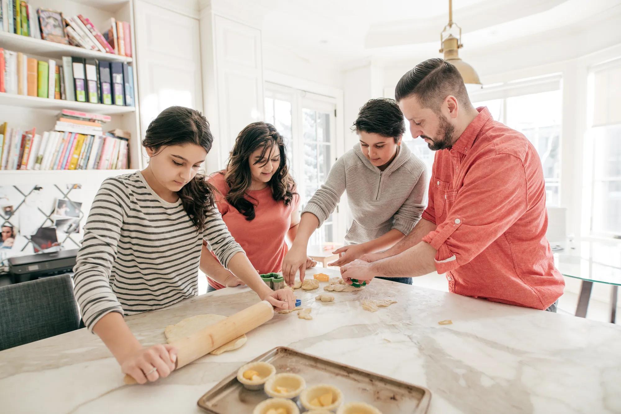 Family baking in new home kitchen