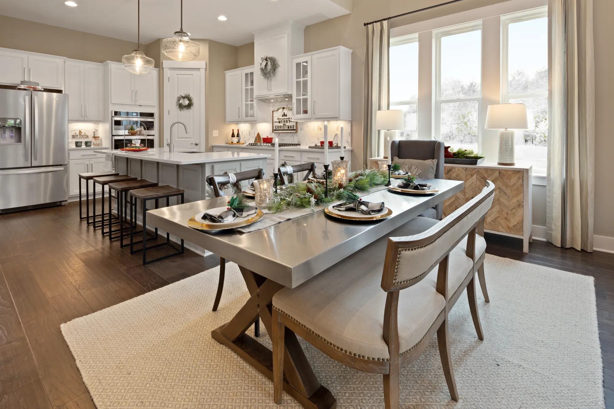 A gorgeous table that is decorated for the holidays in a new home