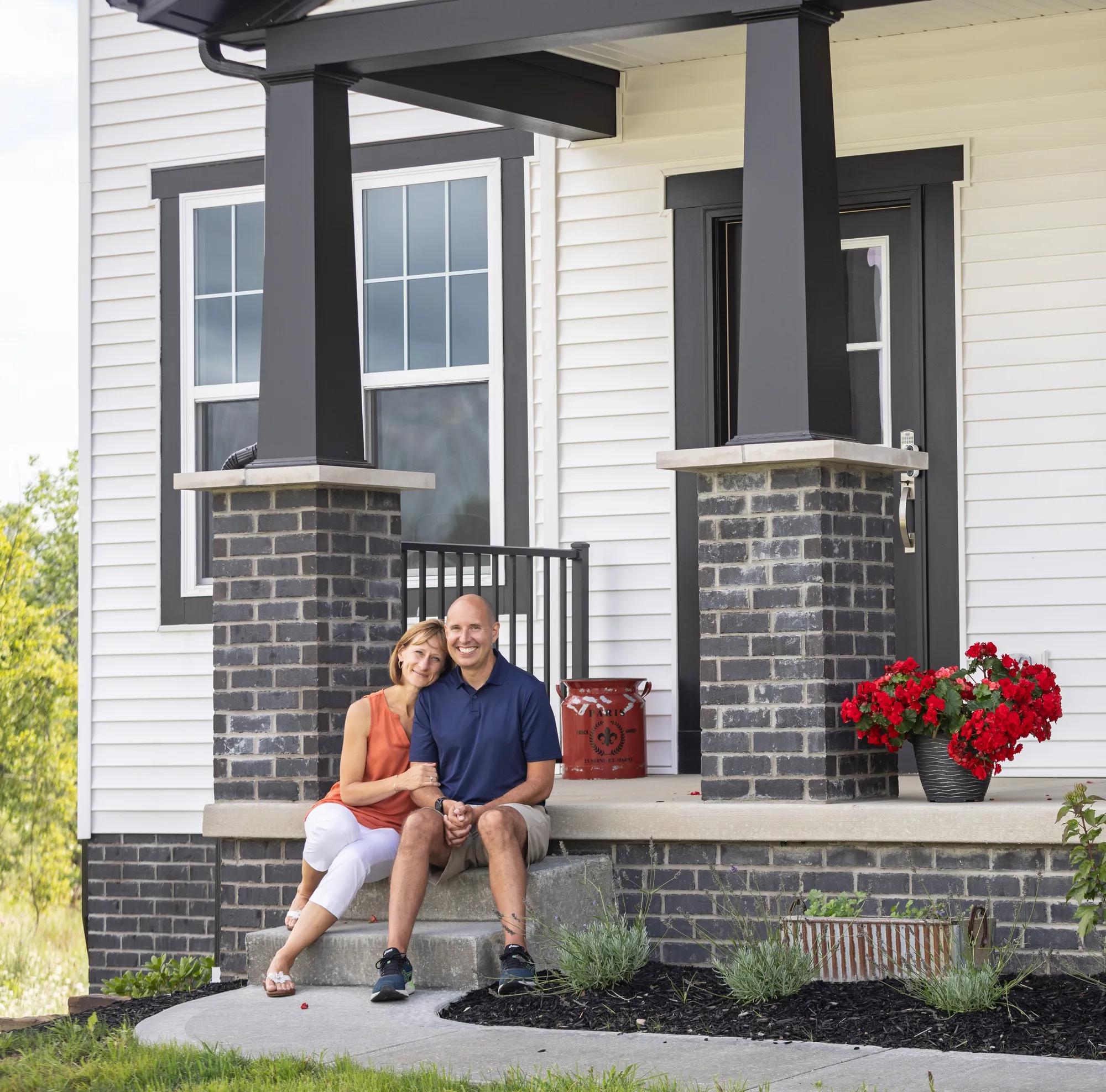 New homeowner family enjoying a gorgeous day from their lovely Buchanan front porch