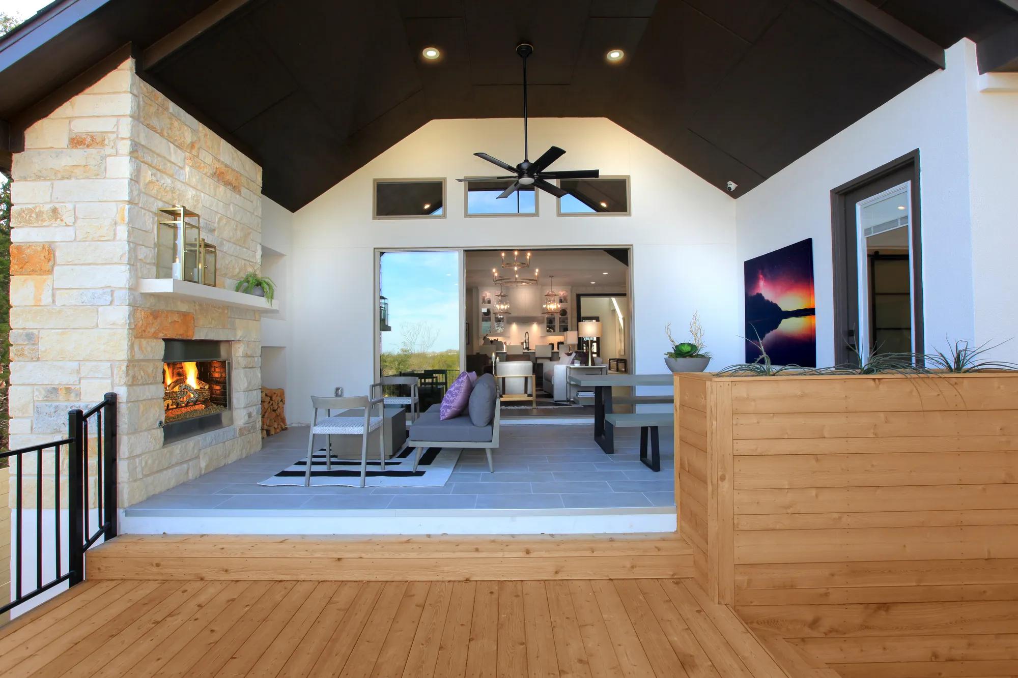 covered porch with multi-panel sliding door to family room