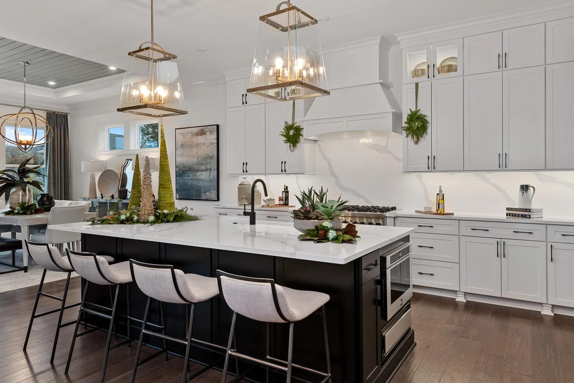 custom kitchen with stainless-steel appliances decorated for the holidays
