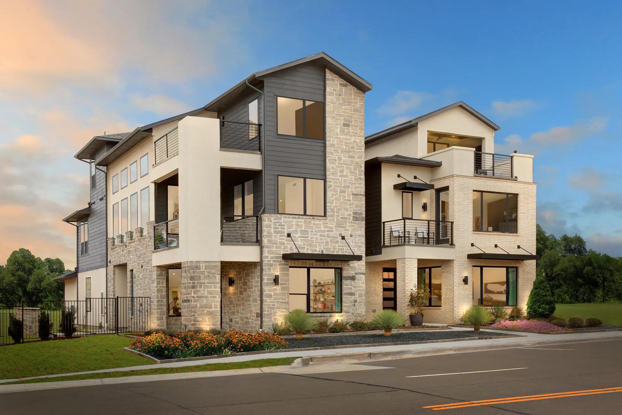 custom home with stone, stucco and siding