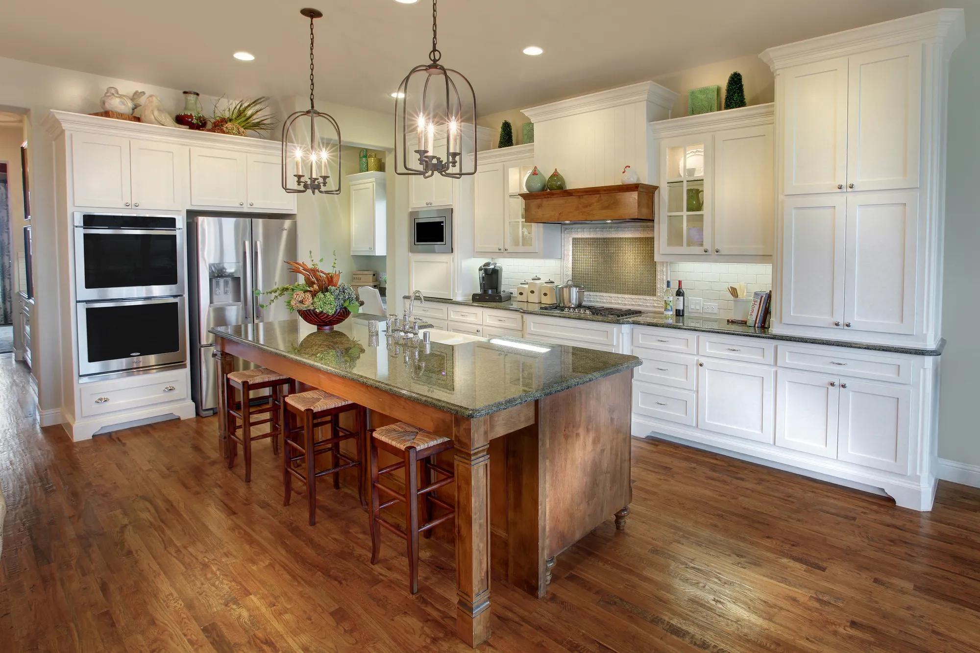 Kitchen with white cabinets and stainless steel appliances