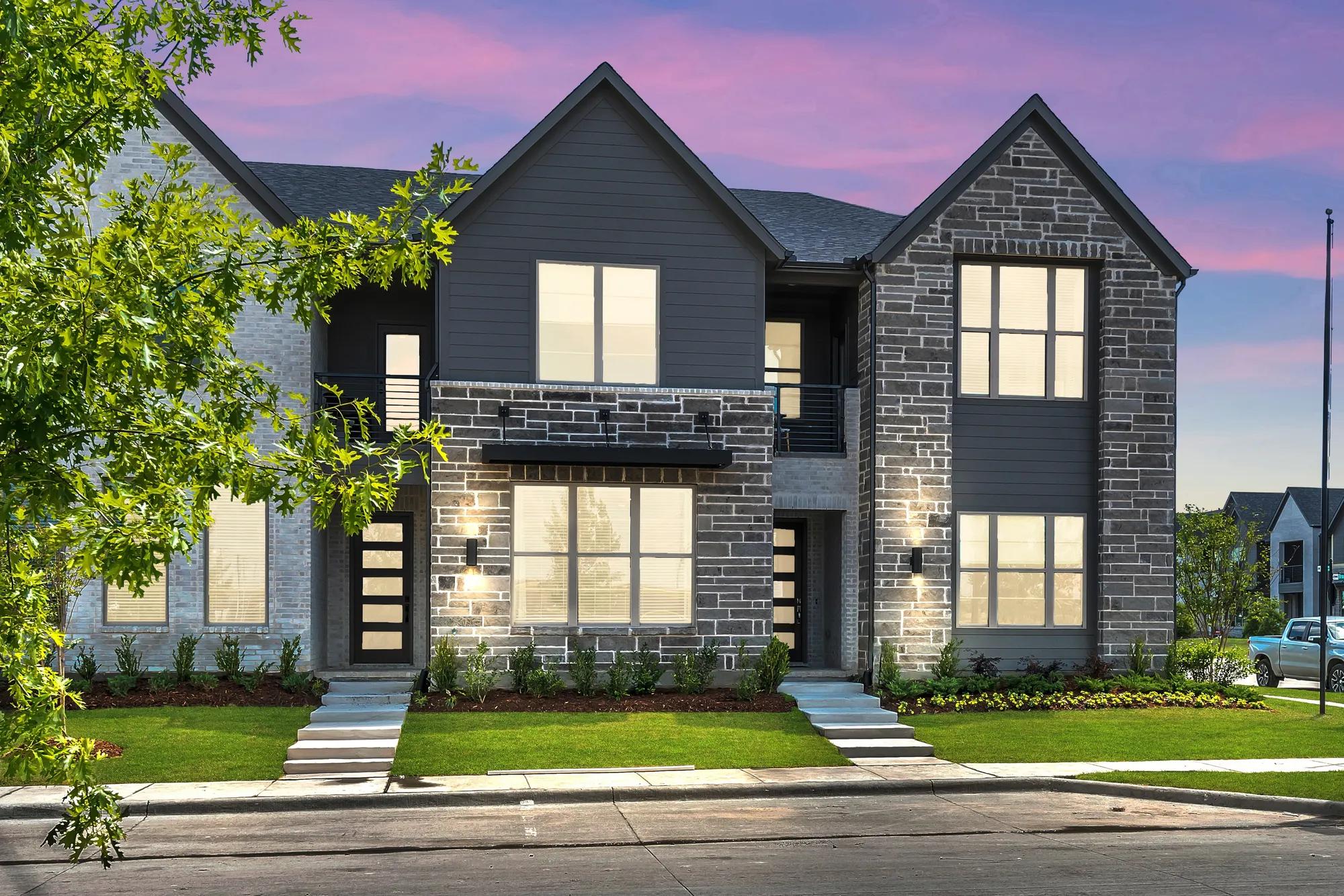 New construction townhome with stone and siding exterior 