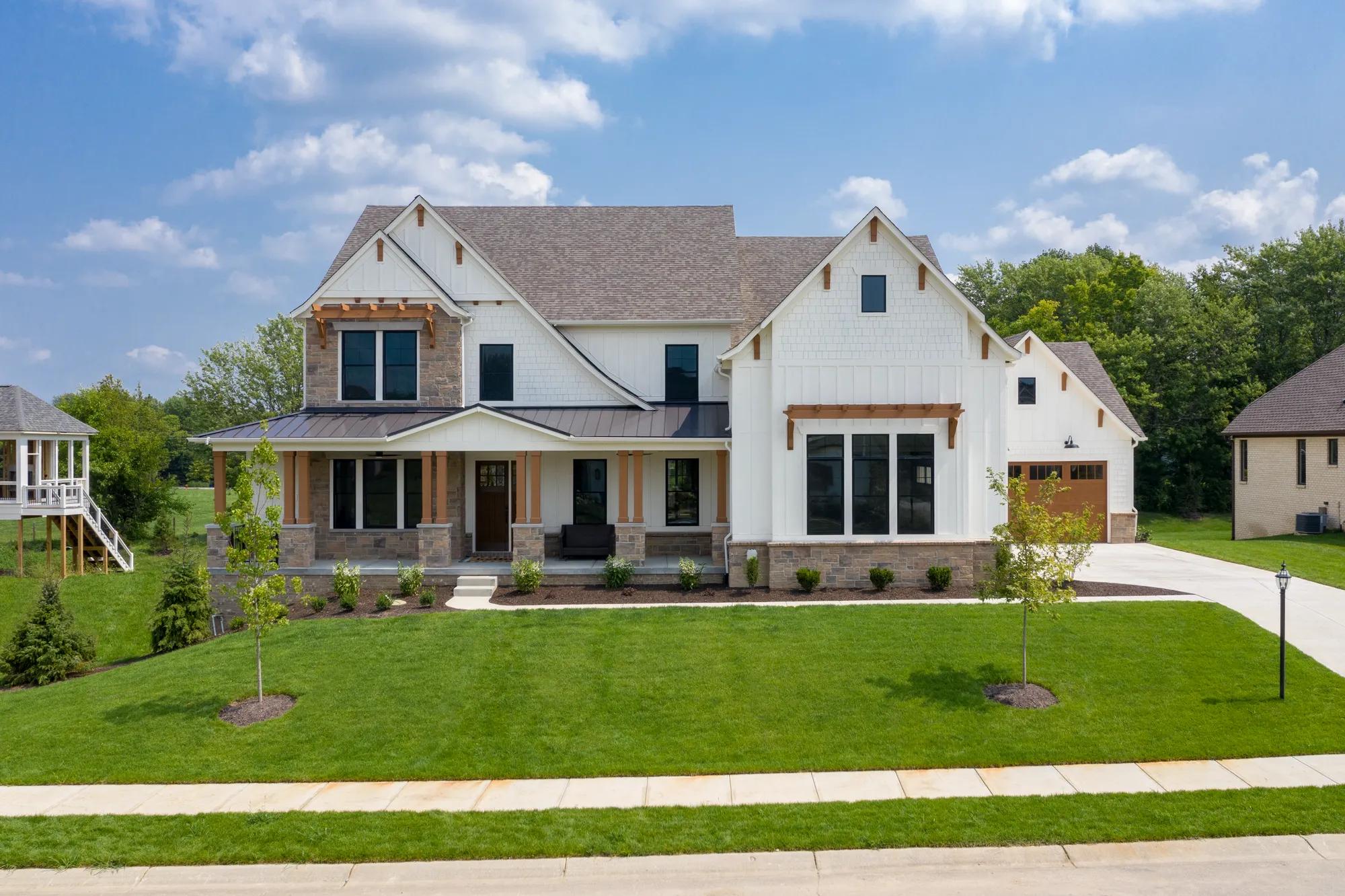 This gorgeous home exterior has stone and wooden accents