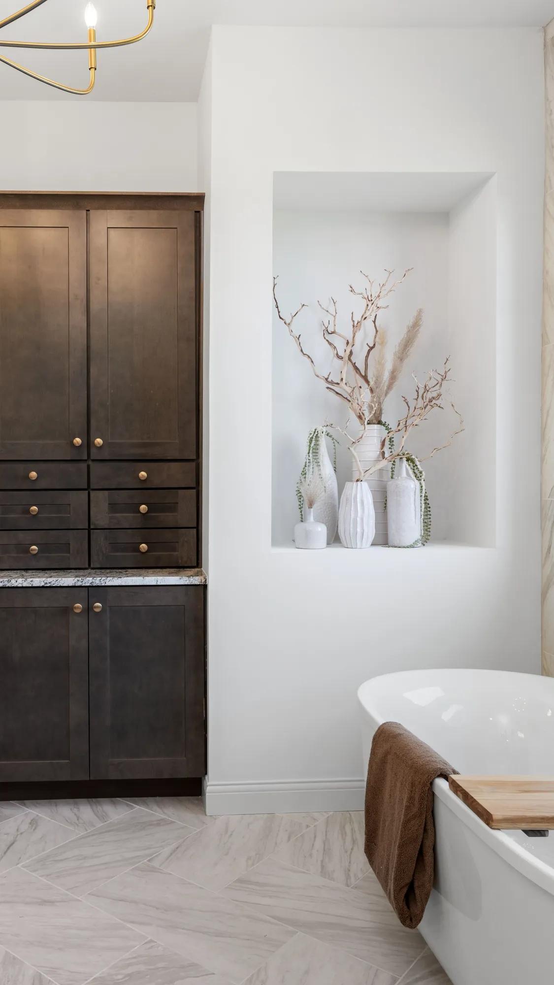 Custom home bathroom with tall vanity cabinets
