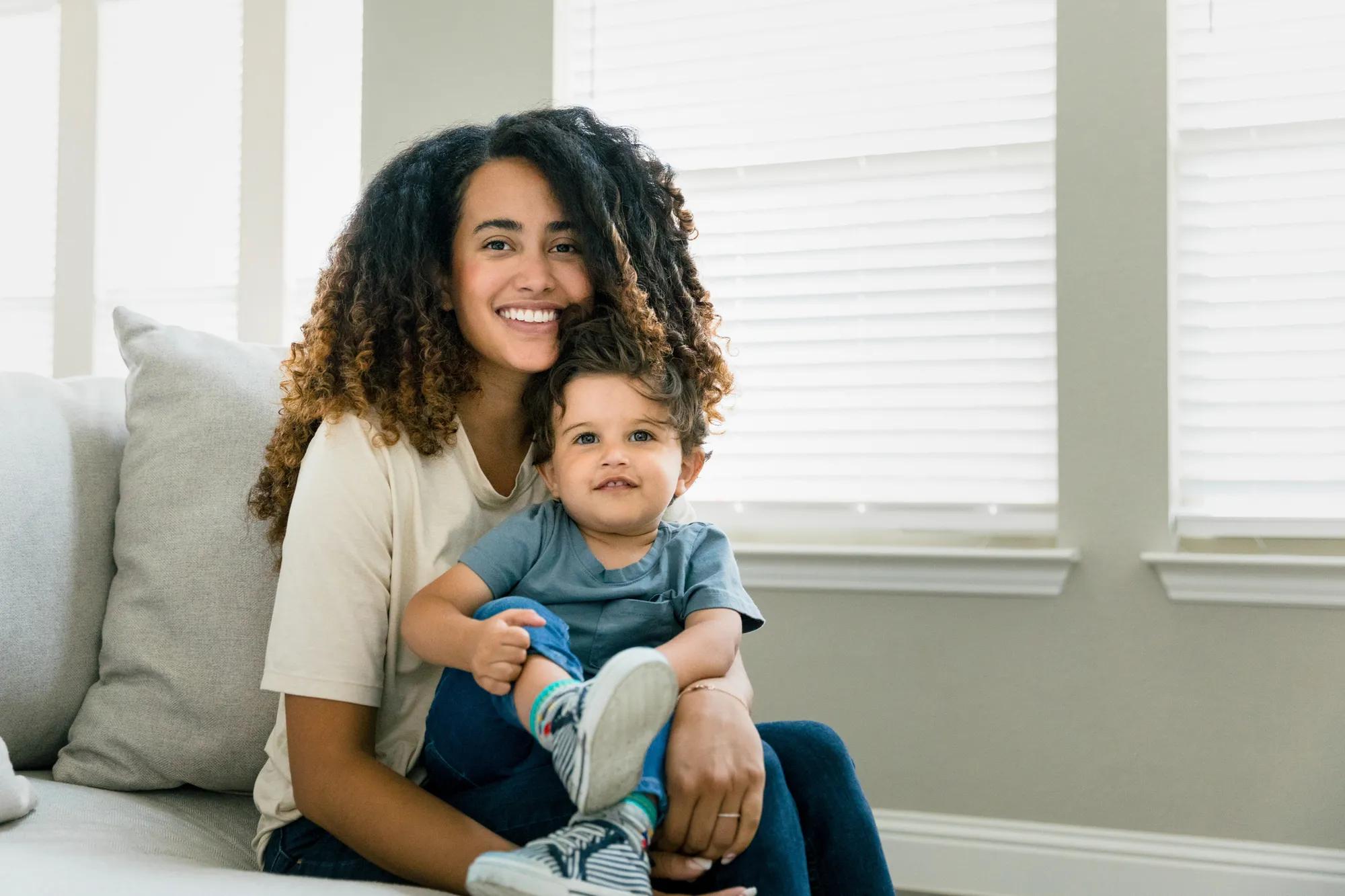 Mother and son relaxing in home