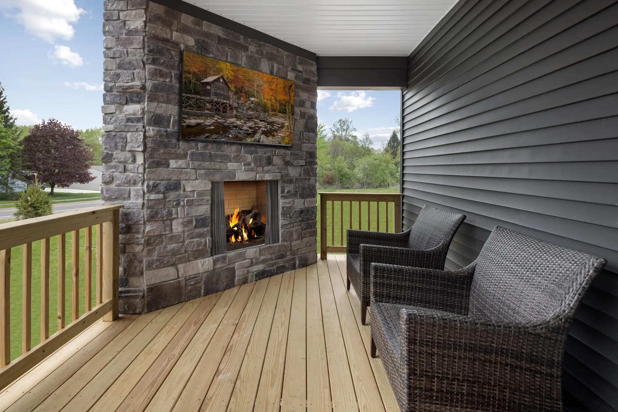 covered patio with fireplace