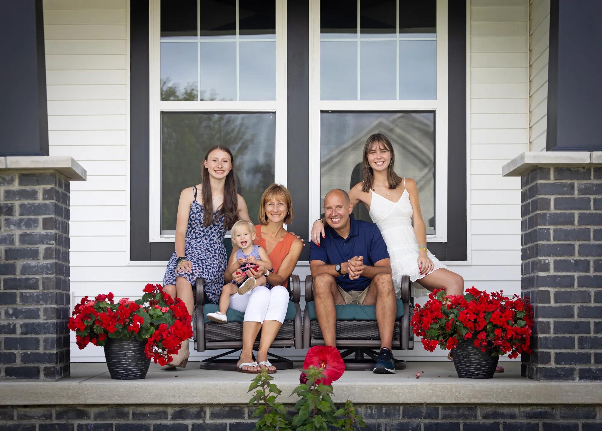 New homeowner family enjoying a gorgeous day from their lovely Buchanan front porch