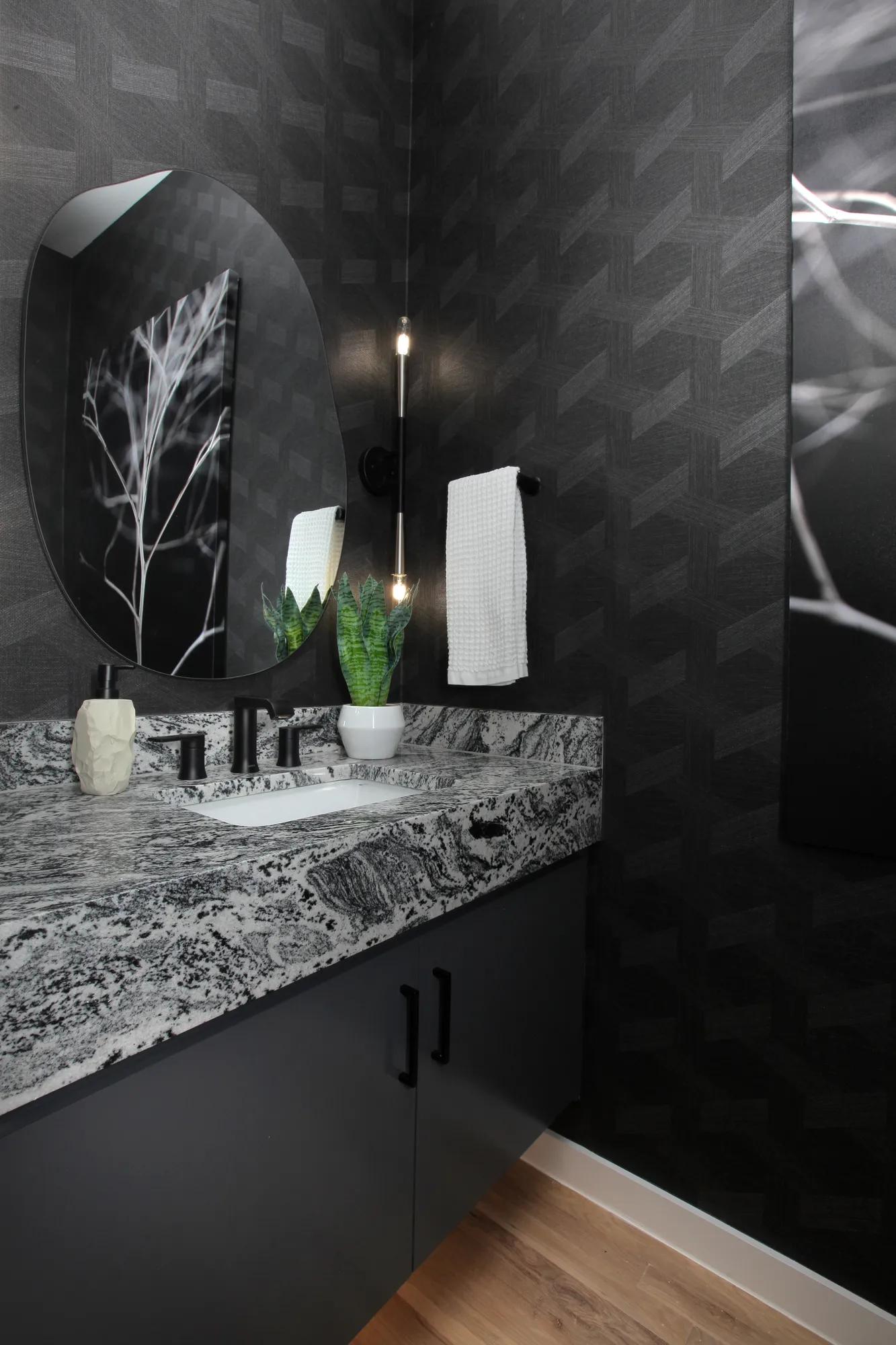 custom half bath with black quartz counter