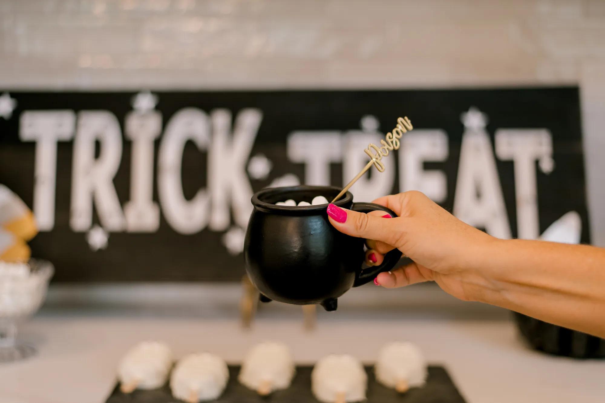 A witches brew themed dessert at a new home event
