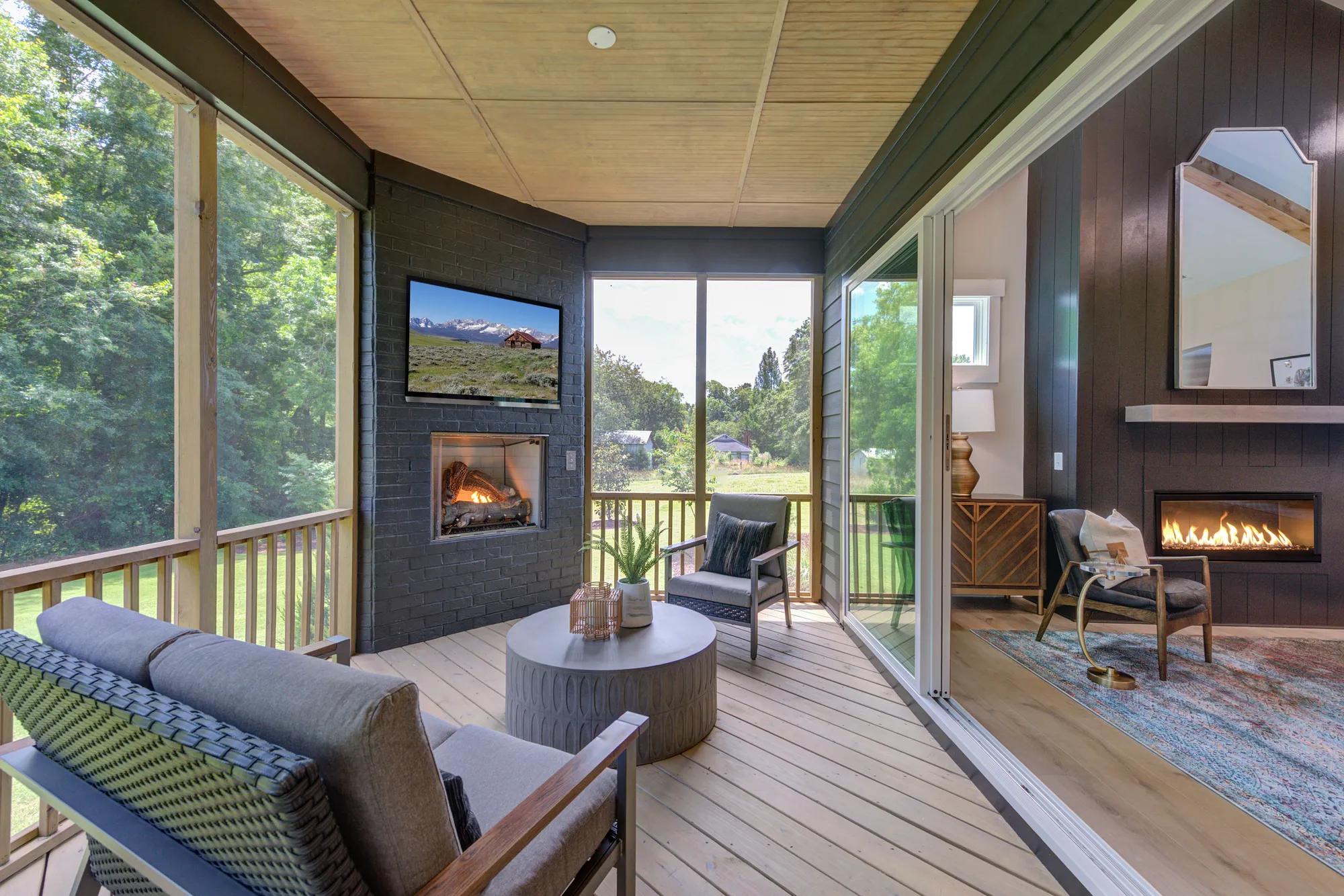 custom screened-in outdoor living area with fireplace