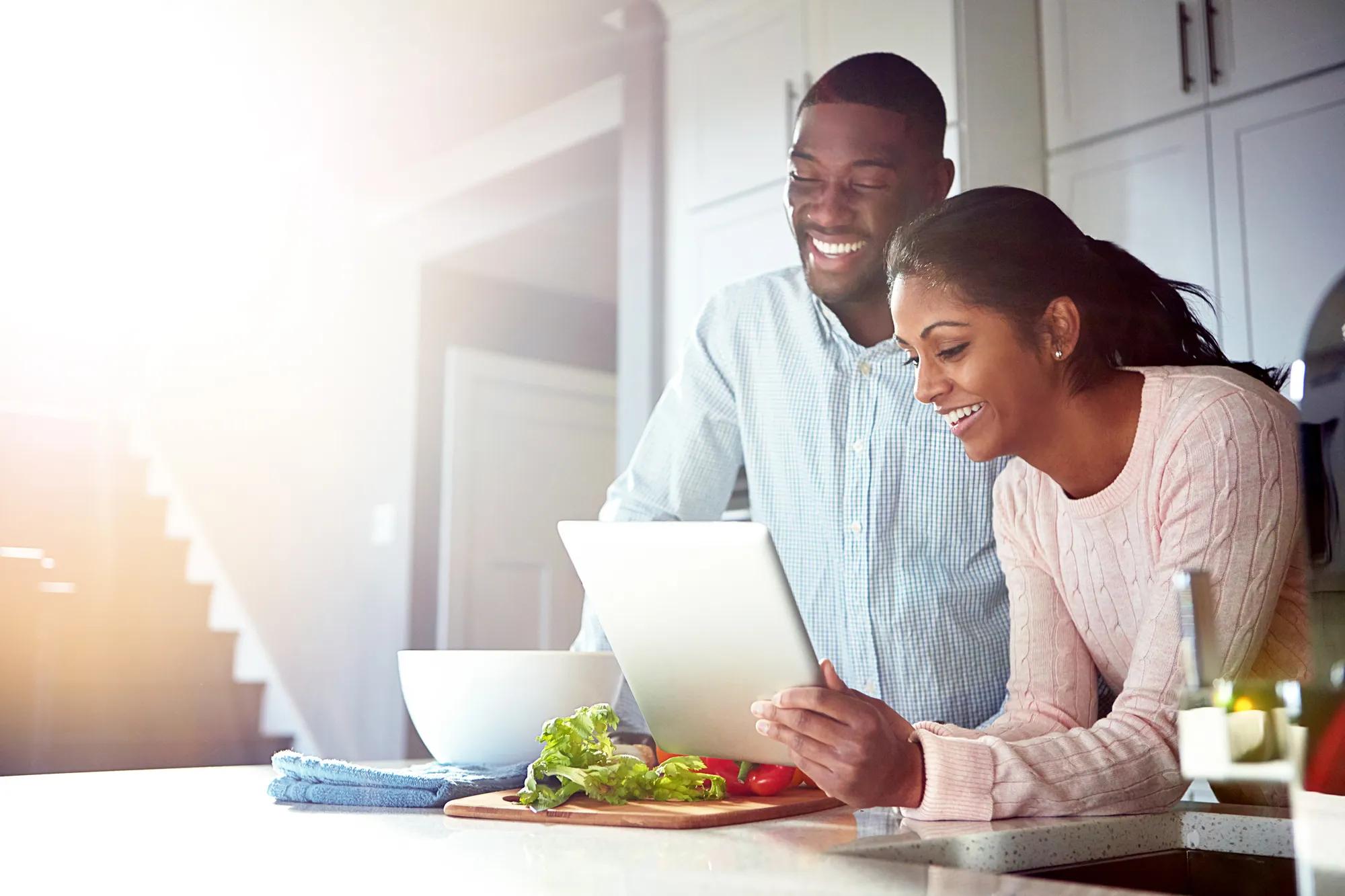 Couple cooking a recipe at home