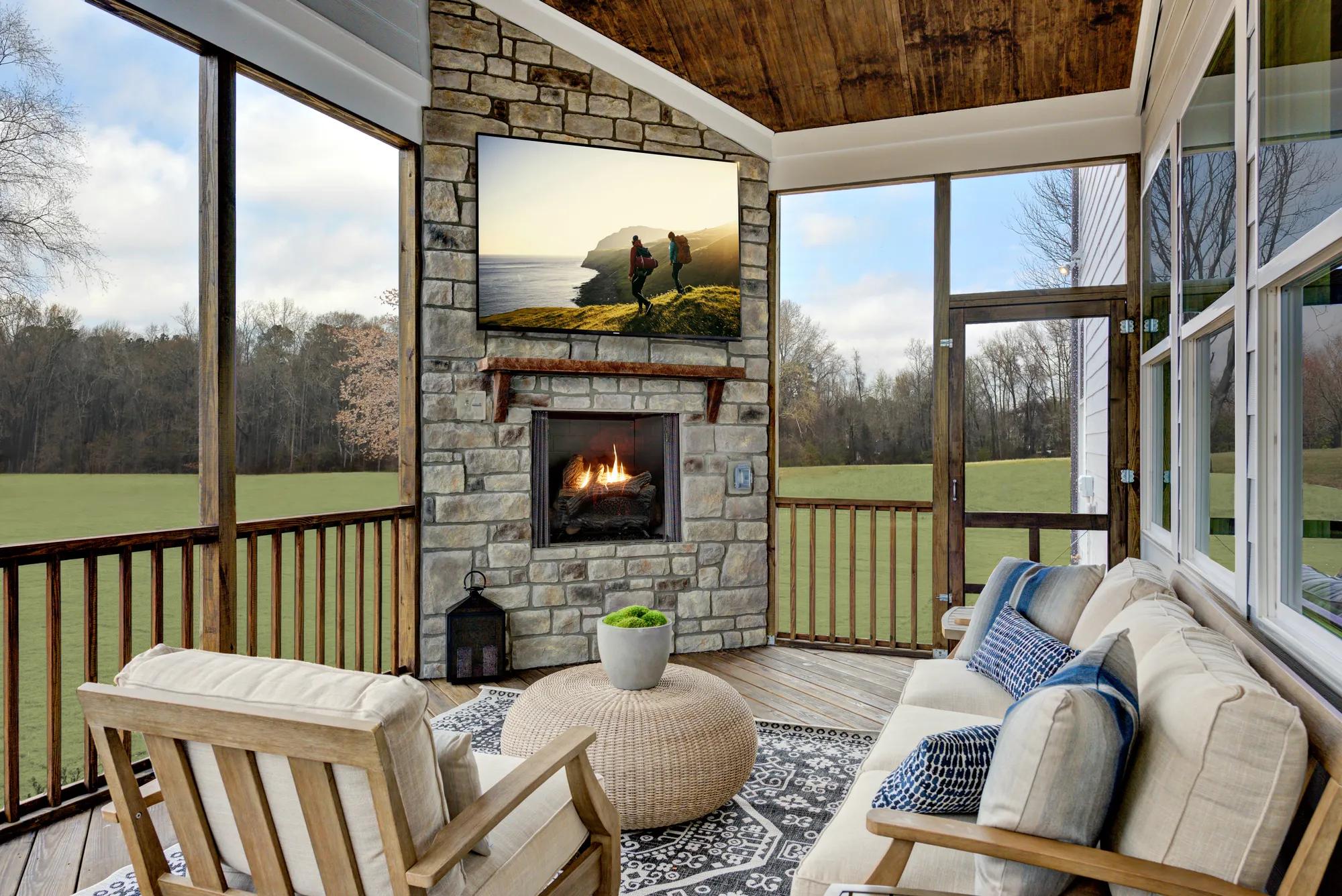 screened-in porch with stone fireplace