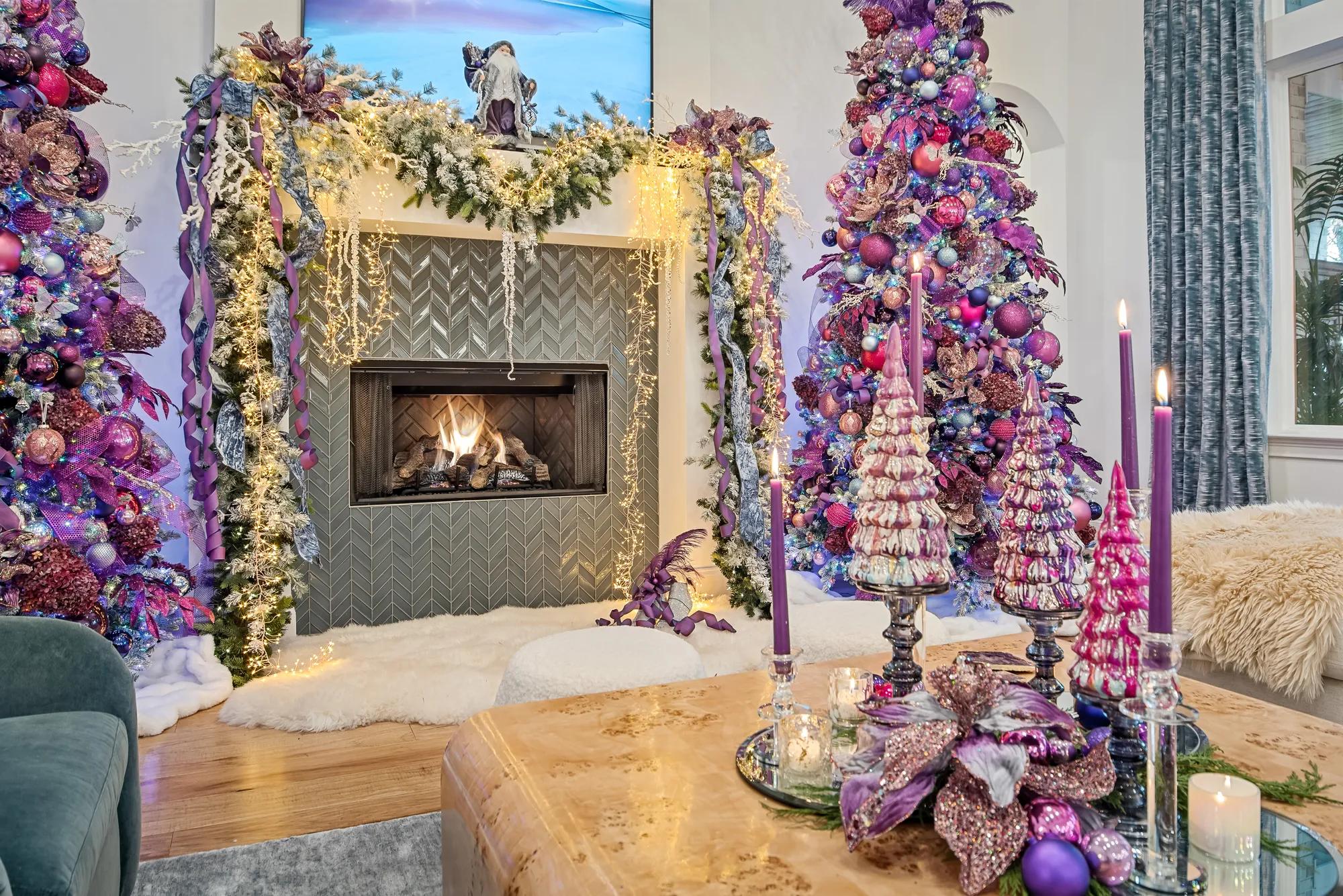 Drees custom contemporary fireplace draped with holiday garland